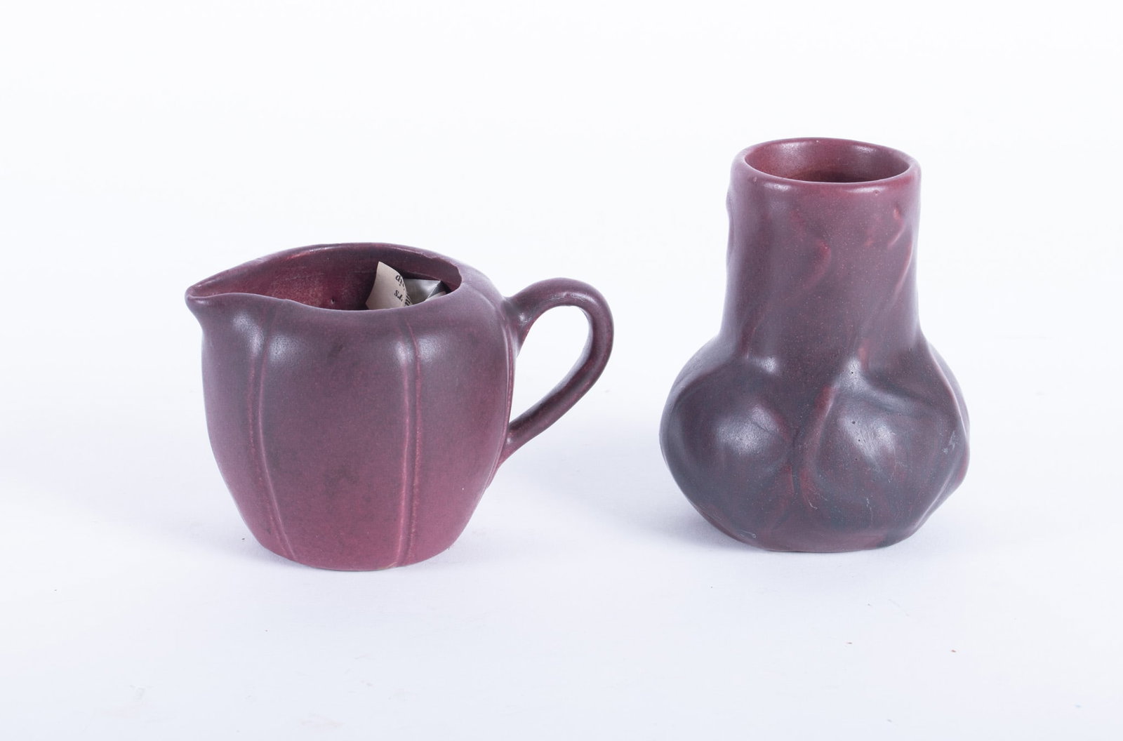 Van Briggle Mulberry Glaze Pottery Vase and Pitcher: Van Briggle Mulberry Glaze Pottery Vase and Pitcher both signed underneath Height of vase: 4 inches; Height of pitcher: 3 inches