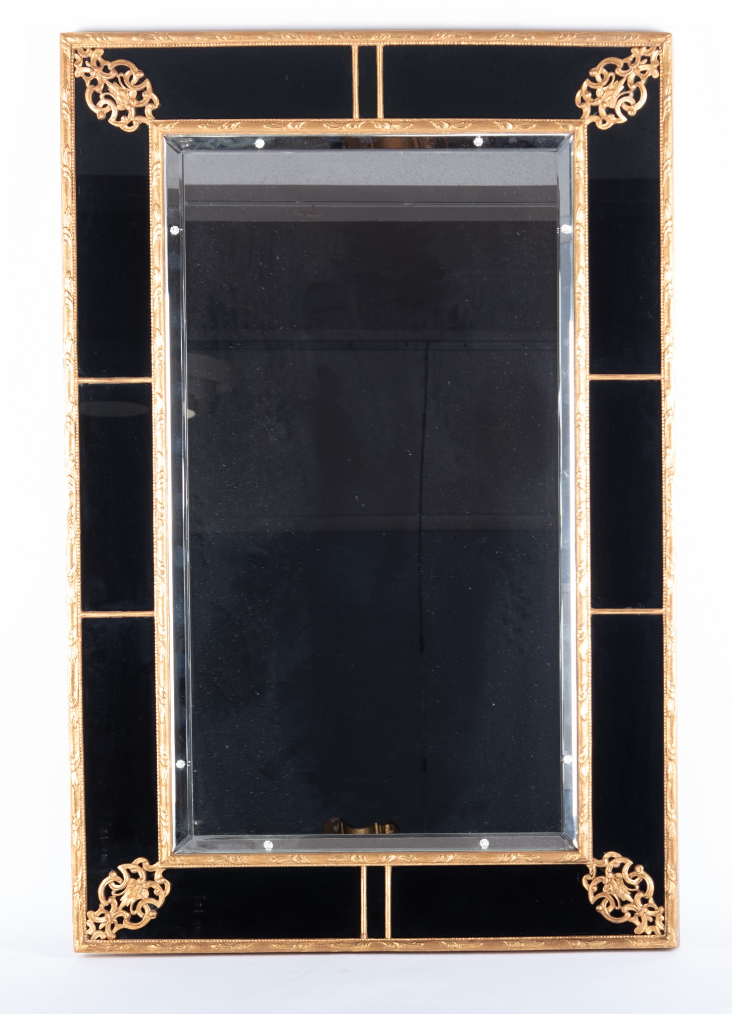 Neoclassical Style Wall Mirror: Neoclassical Style Wall Mirror Framed in black glass and giltwood, with ormolu accents to the corners, and beveled glass. 45 x 30 inches