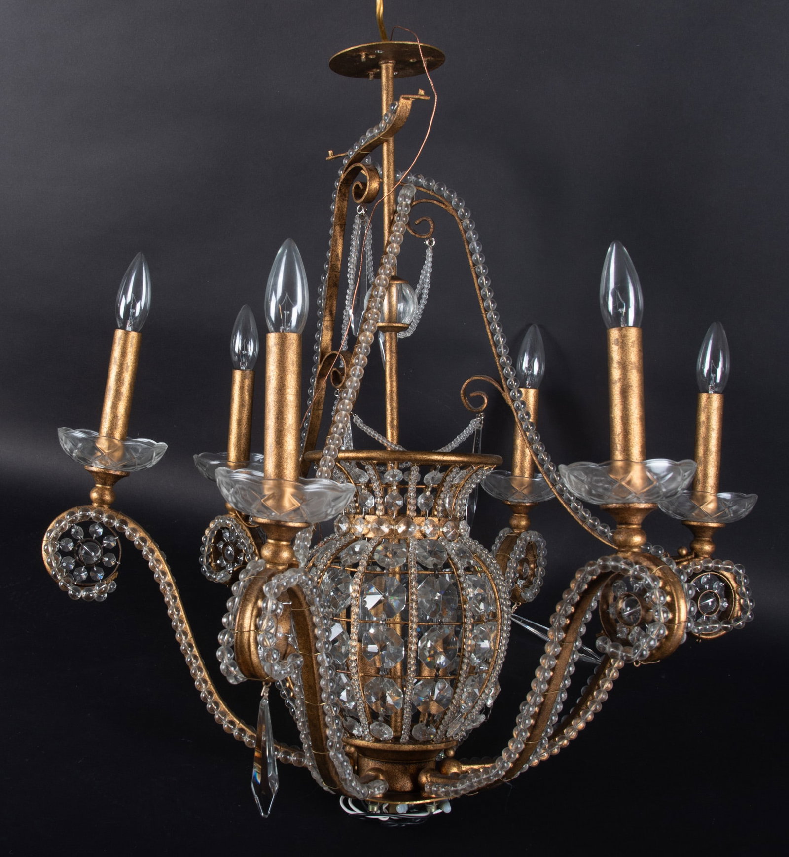 A Designer Italian Style Bronzed Metal Six Light Chandelier: A Designer Italian Style Bronzed Metal Six Light Chandelier Last quarter of the 20th century, a 6 candle arm fixture featuring sinuous curving arms with crystal spheres lining each side. The