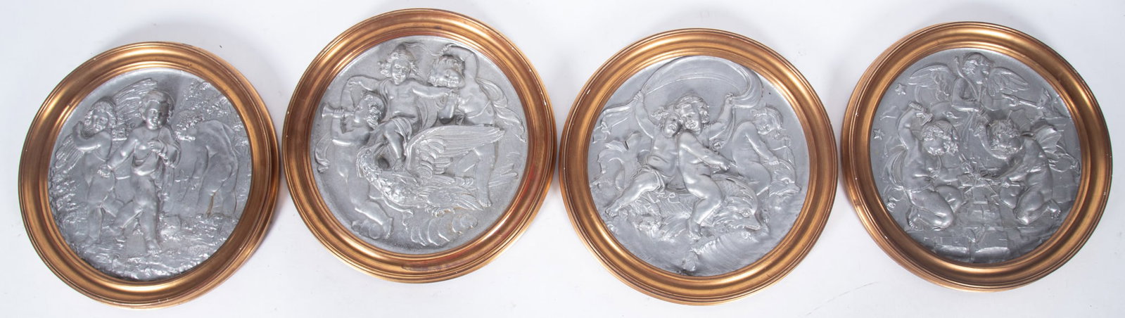 Four Neoclassical Style Roundels: Four Neoclassical Style Roundels four white metal roundels depicting trios of Putti in gilt wood frames diameter: 15 1/2 inches; 19 1/2 inches (overall with frame)