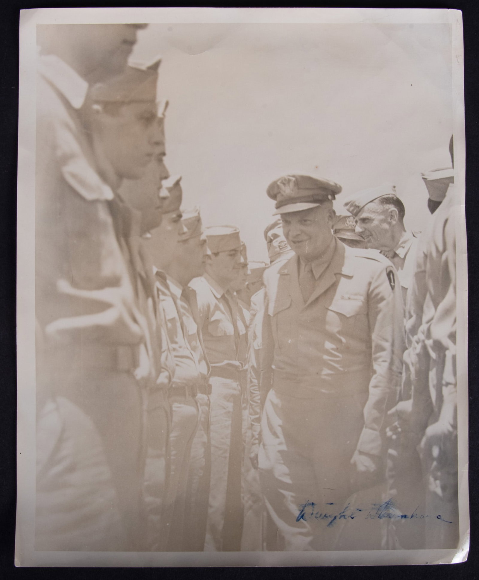 Dwight D. Eisenhower Signed Black And White Photograph, Normandy, France: Dwight D. Eisenhower Signed Black And White Photograph, Normandy, France Signed lower right, 13, August, 1944 while Eisenhower was inspecting the troops in Normandy France 10 x 8 inches