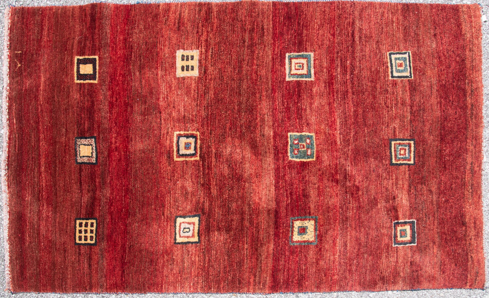 Handwoven Room Rug: Handwoven Room Rug Orange field with a series of twelve square motifs in various sizes and colors. 6' 3" x 4'