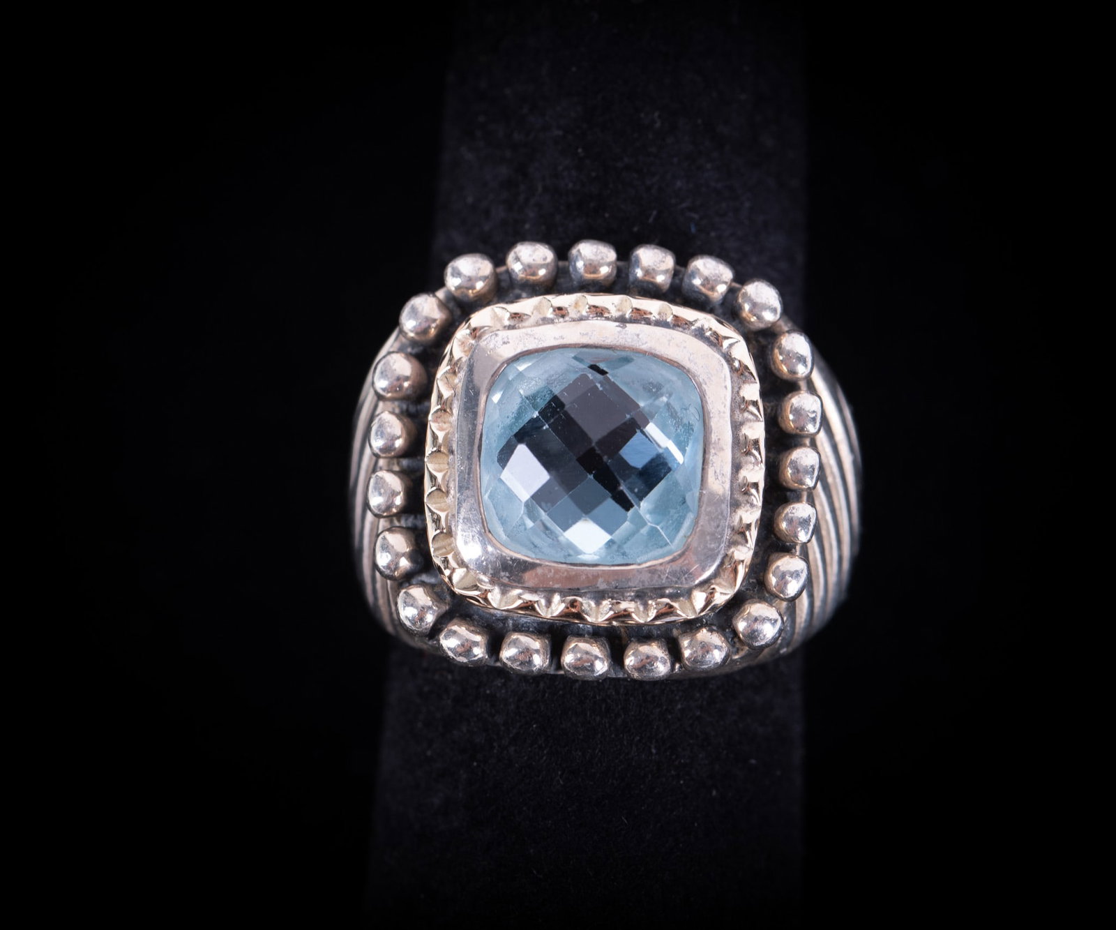 Sterling Silver/14K Designer Ring with Blue Topaz: Sterling Silver/14K Designer Ring with Blue Topaz This ring is marked 925-14K-Italy and signed with a capital B in a double circle. The weight including the stone is 13.5g and the ring size 7.