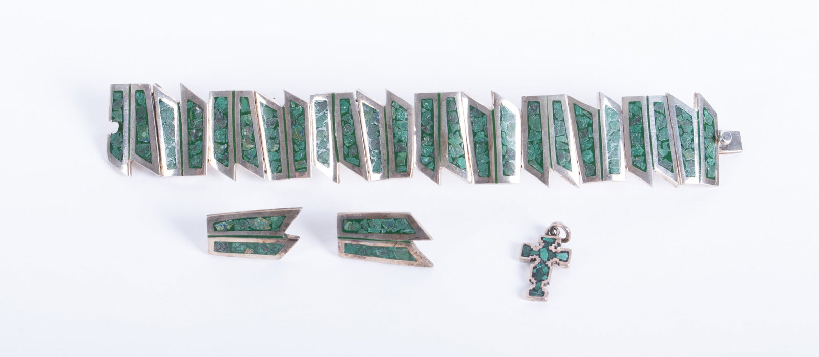 Sterling Silver with Malachite Inlay Three Piece Set: Sterling Silver with Malachite Inlay Three Piece Set This set features geometric alternating frames inlaid with malachite chips. The pieces are marked 925 Mexico. The bracelet is 7 inches long and an 