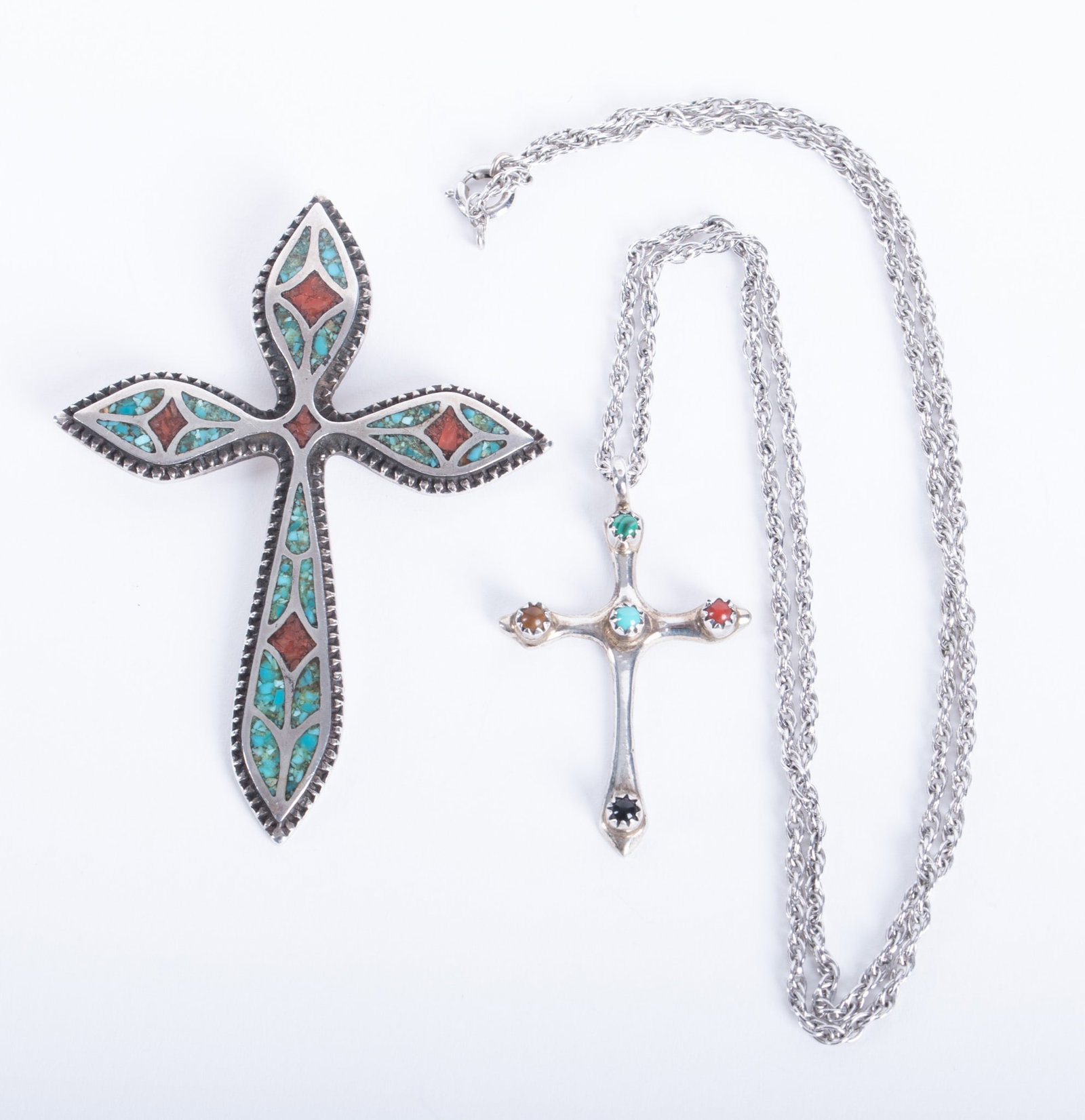 Sterling Silver Native American Crosses: Sterling Silver Native American Crosses The inlaid cross measures 3 x 2 inches. The smaller cross with stones measures 1 1/2 x 1 inch. It is signed "L.B. and strung on a 23 1/2 inch sterling silver ch