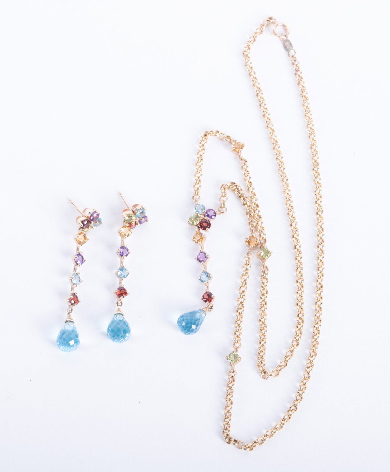 10K Yellow Gold Necklace & Earrings Set with Gemstones: 10K Yellow Gold Necklace & Earrings Set with Gemstones This lovely set was made in Mexico. The necklace is 16 1/2 inches long and set with blue topaz, garnet, amethyst and peridot. The drop earrings m