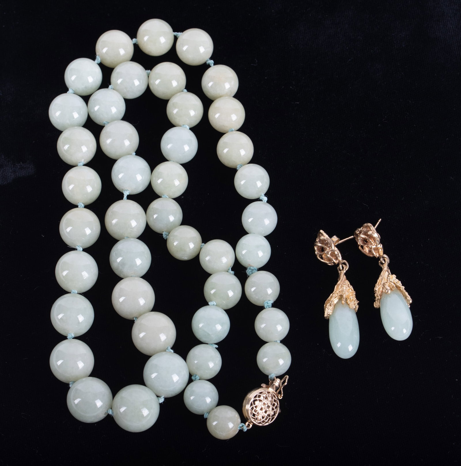 Exceptional Jade Necklace with Earrings: Exceptional Jade Necklace with Earrings The necklace is graduated with the largest stone being 14mm. The clasp is 14K yellow gold. The jade earrings are set in a 14K brutalist style mounting, 1 3/4