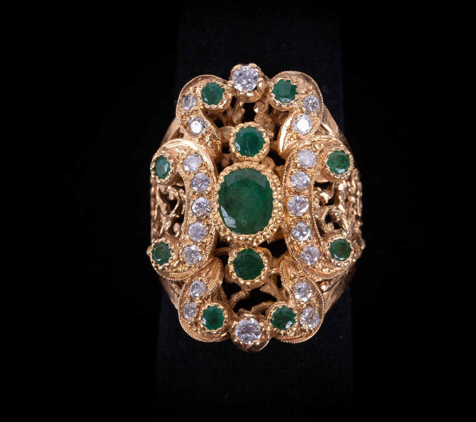 Striking 18K Emerald & Diamond Ring: Striking 18K Emerald & Diamond Ring This is an exceptional Baroque-inspired design, distinguished by intricate openwork and exquisitely executed emerald and diamond settings. The emeralds have a