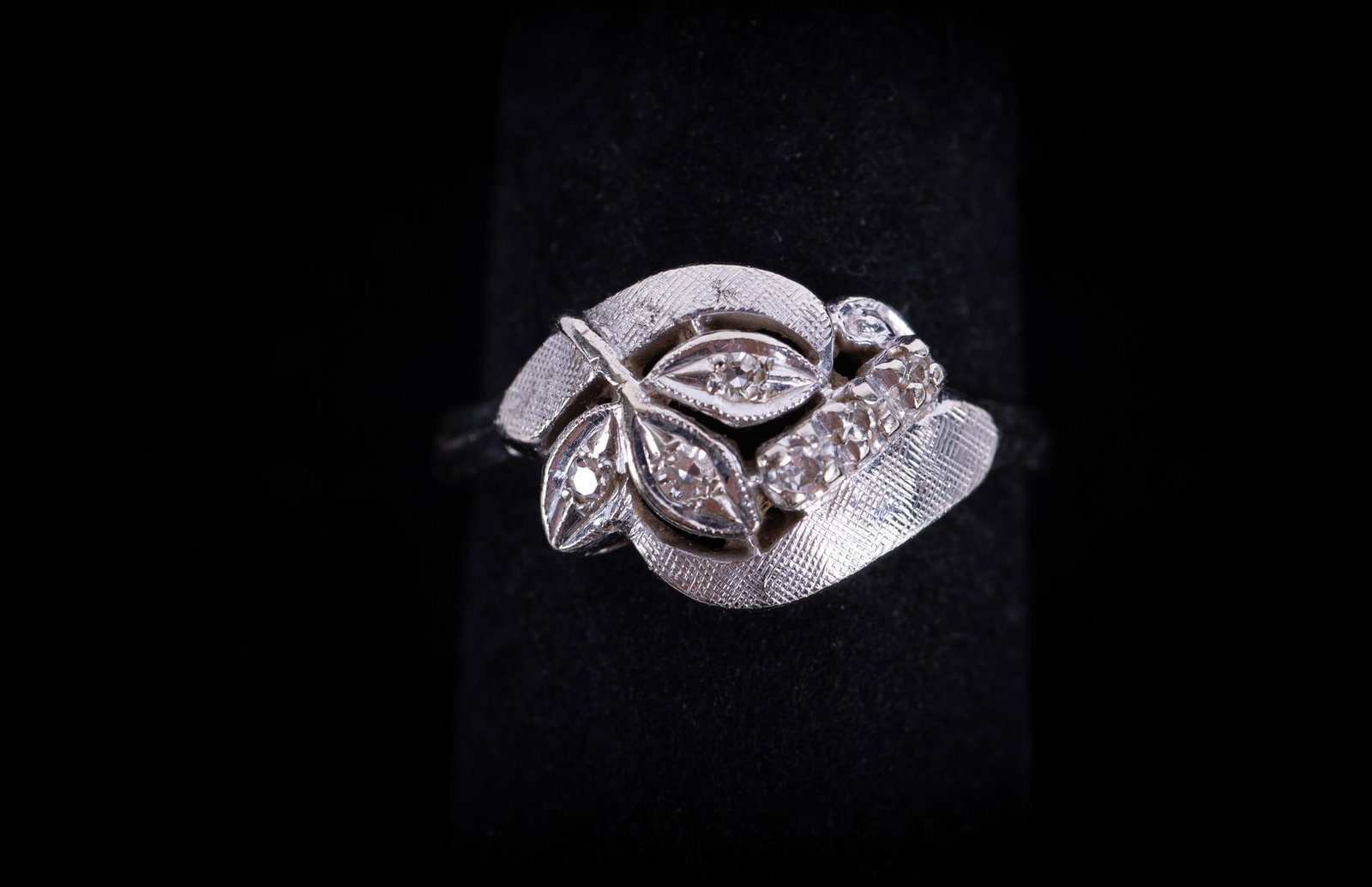 Vintage 14K White Gold Diamond Ring: Vintage 14K White Gold Diamond Ring This classic ring has a finely textured white gold design and the diamond weight is approximately .10CTW. Ring size is 7 and the weight including stones is 3.8g.