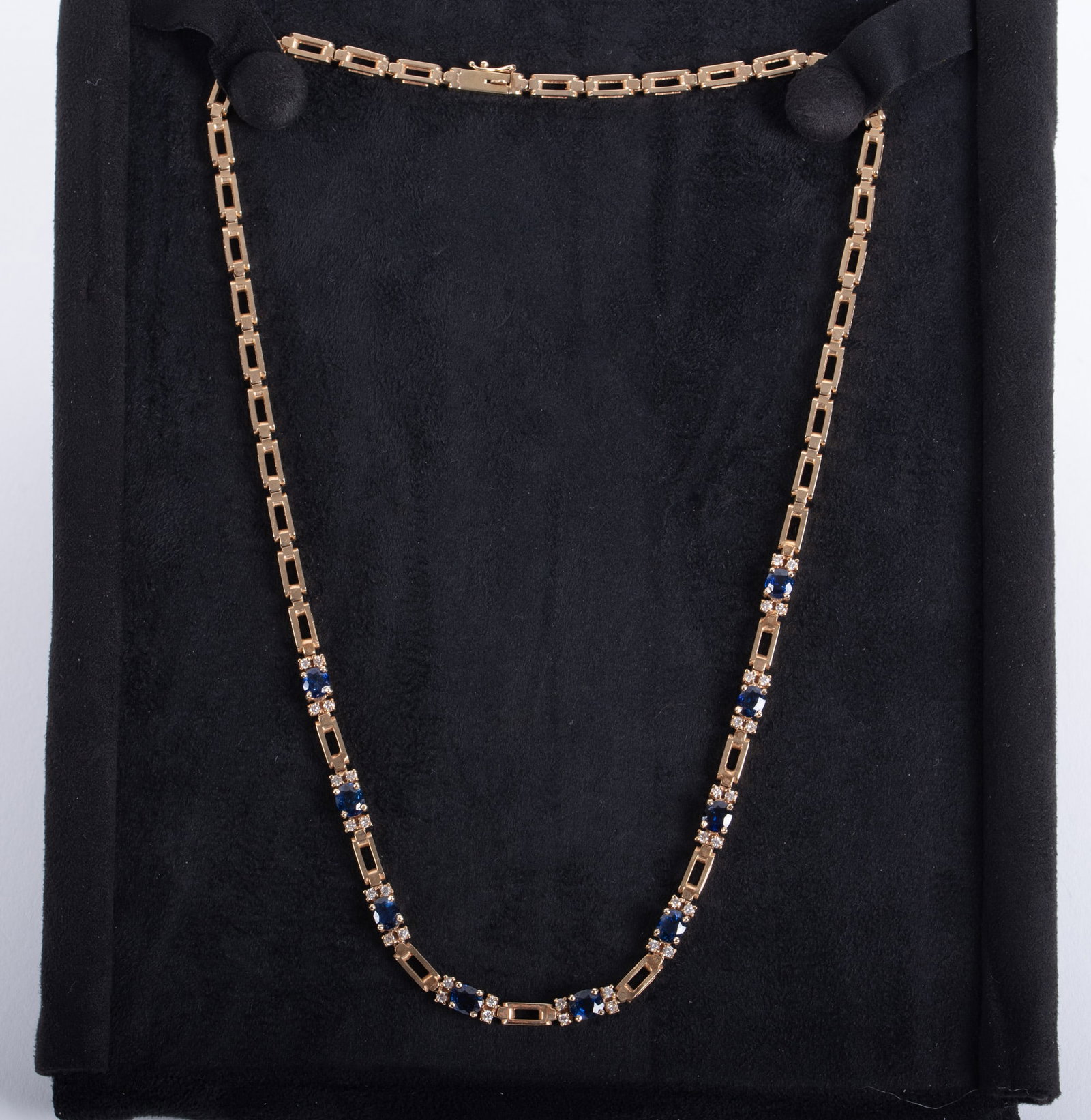 14k Yellow Gold Sapphire Diamond Necklace: 14k Yellow Gold Sapphire Diamond Necklace The design of this 18 inch long necklace incorporates rectangular open box links with the attraction being the center arrangement of 9 sapphire and diamond se