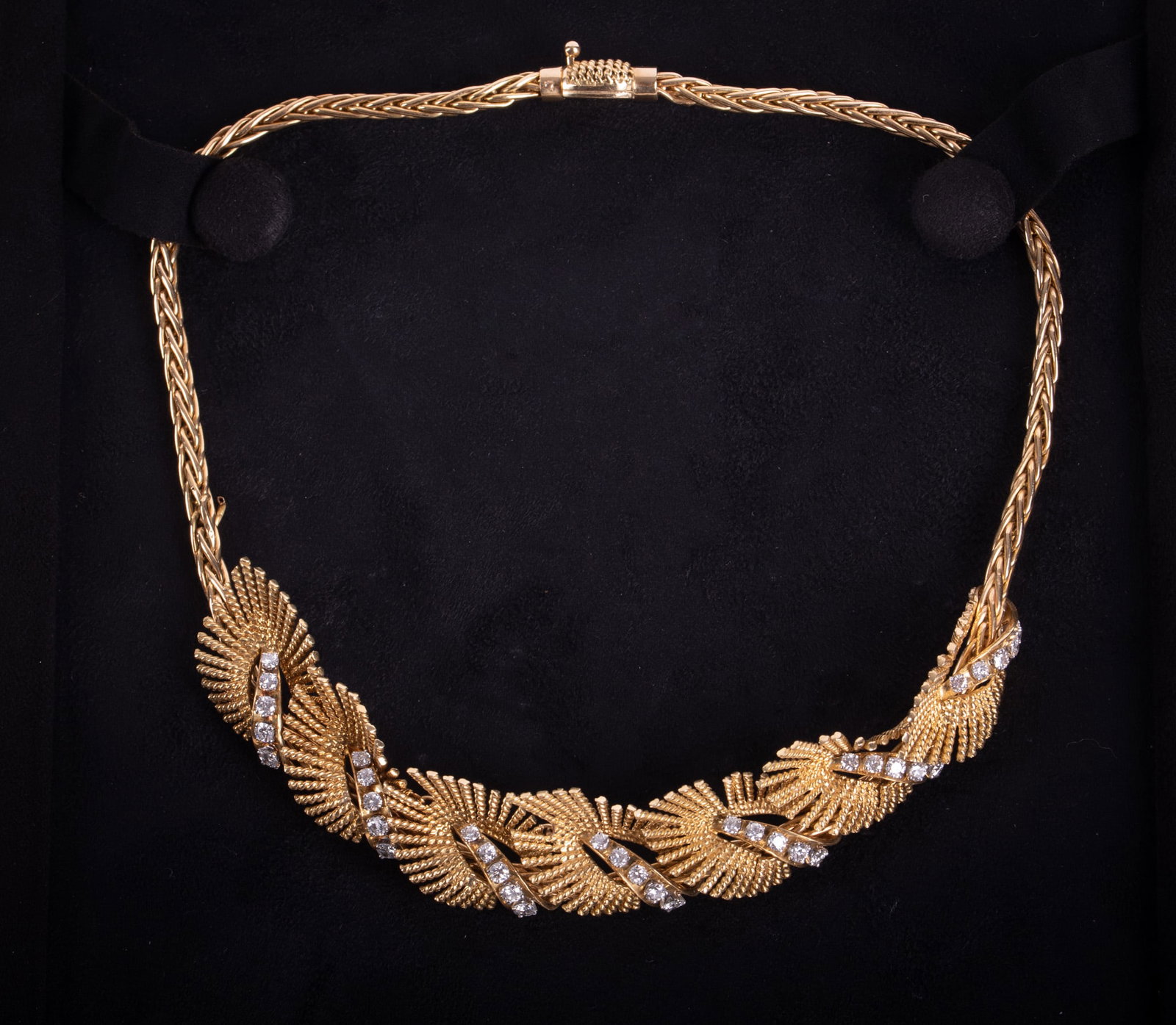 18K Yellow Gold Diamond Choker Necklace: 18K Yellow Gold Diamond Choker Necklace This necklace has a mid-century vintage look. The feather or leaf design lends to its organic feel. It is 14 inches long and weighs 40.90g including the approxi