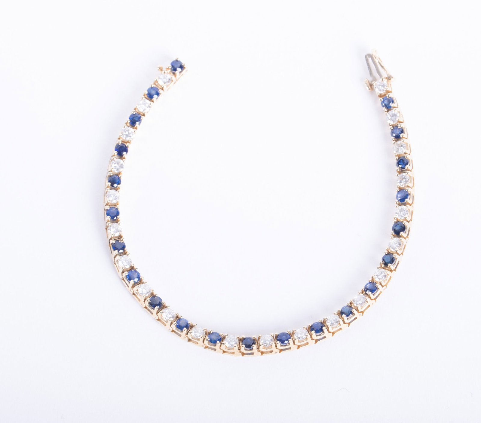 14K Yellow Gold Sapphire Diamond Tennis bracelet: 14K Yellow Gold Sapphire Diamond Tennis bracelet This classic bracelet is a beauty with approximately 2CTW in Brilliant Cut diamonds. The width of the bracelet is 3.3mm and the length is 7 inches. Wei