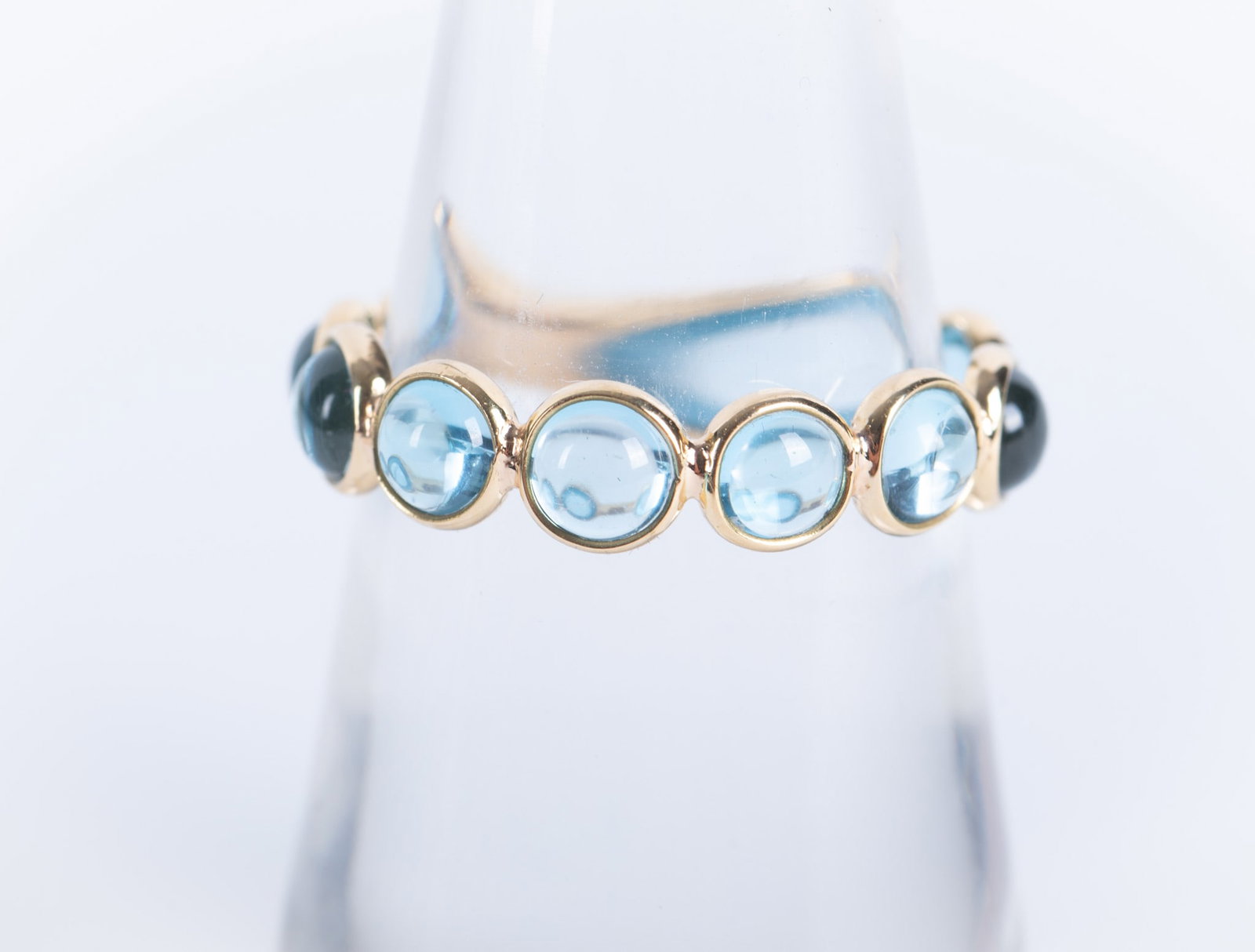 18K Gold Natural Blue Topaz Band Ring: 18K Gold Natural Blue Topaz Band Ring total weight 9.40 carats, Topaz 3.94 carats. Size 6