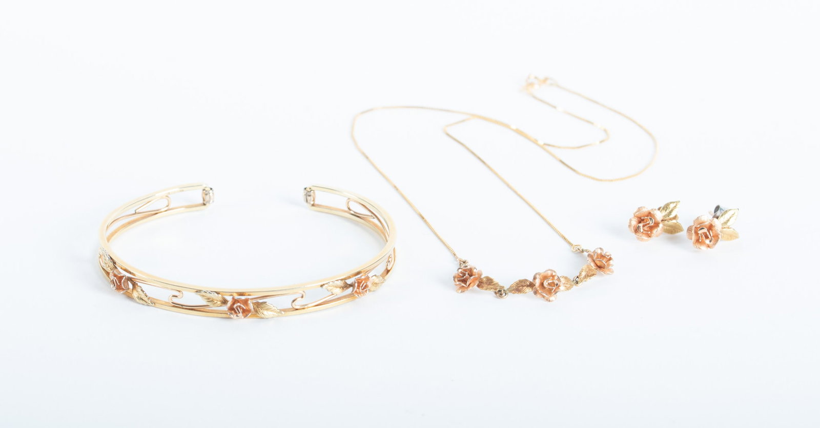 Krementz Bracelet, Necklace & Earrings: Krementz Bracelet, Necklace & Earrings This collectible vintage set features florals in a rose gold tone. The chain on the necklace is marked 14K. The remaining pieces are not marked with a gold stamp