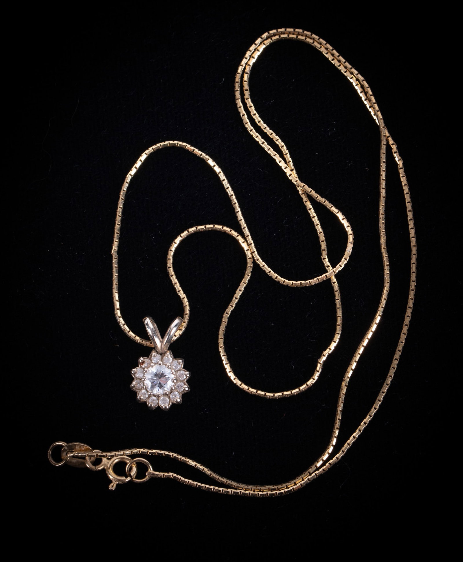 Diamond Pendant-14K Yellow Gold Mounting and Chain: Diamond Pendant-14K Yellow Gold Mounting and Chain The center diamond is approximately .20 carats with the surrounding diamonds weighing approximately .12CTW. Chain length is 18 inches and the gold we