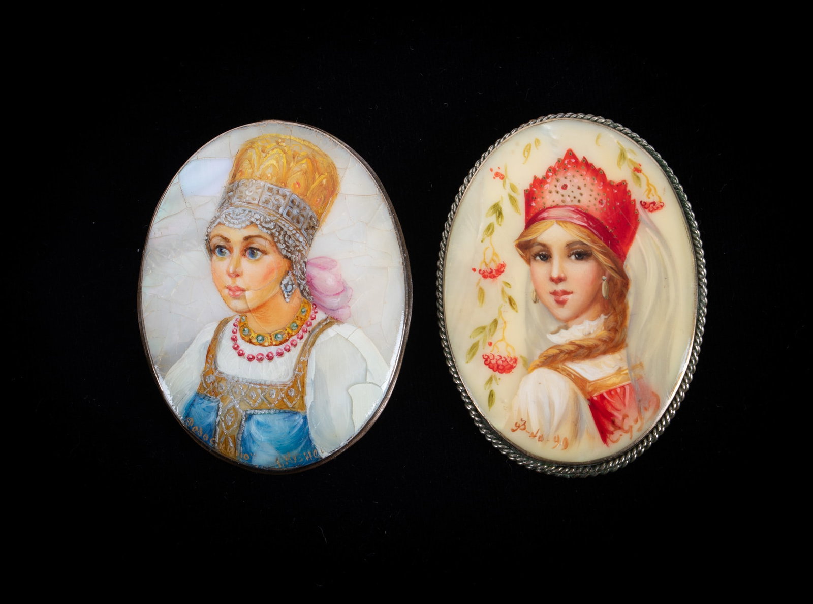 Two Russian Hand Painted Mother of Pearl Portrait Brooches: Two Russian Hand Painted Mother of Pearl Portrait Brooches Both are signed and measure 2 inches x 1 1/2 inches. They are set in silver tone metal. Some crackling on the MOP on one of the pieces.