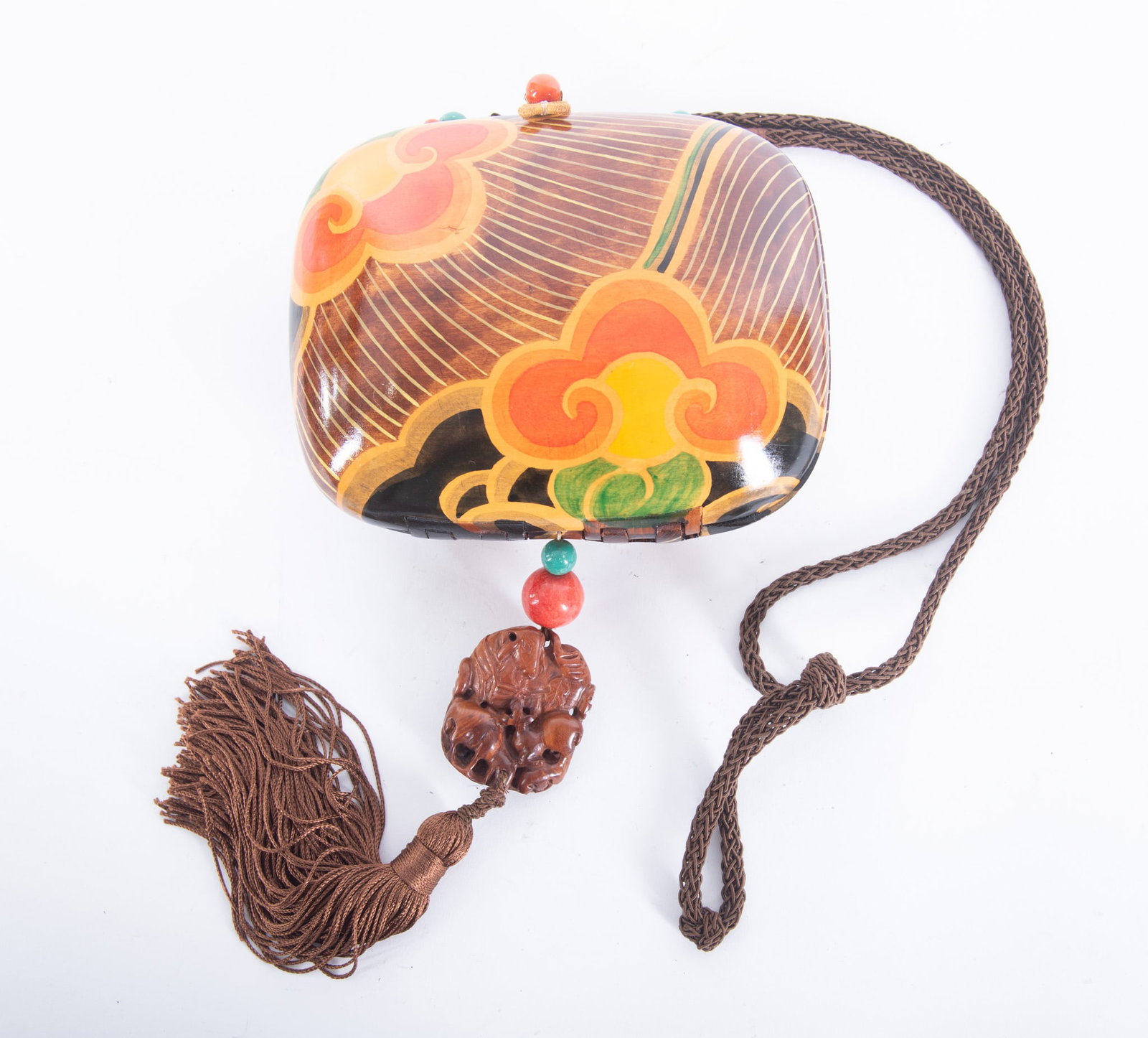 Vintage Rafael Sanchez Hand-Painted Wood Tassel Bag/Purse: Vintage Rafael Sanchez Hand-Painted Wood Tassel Bag/Purse wood lacquer painted in shades of orange, brown and yellow in a fleur de lis style pattern, large carved wood pendant with brown tassel, braid