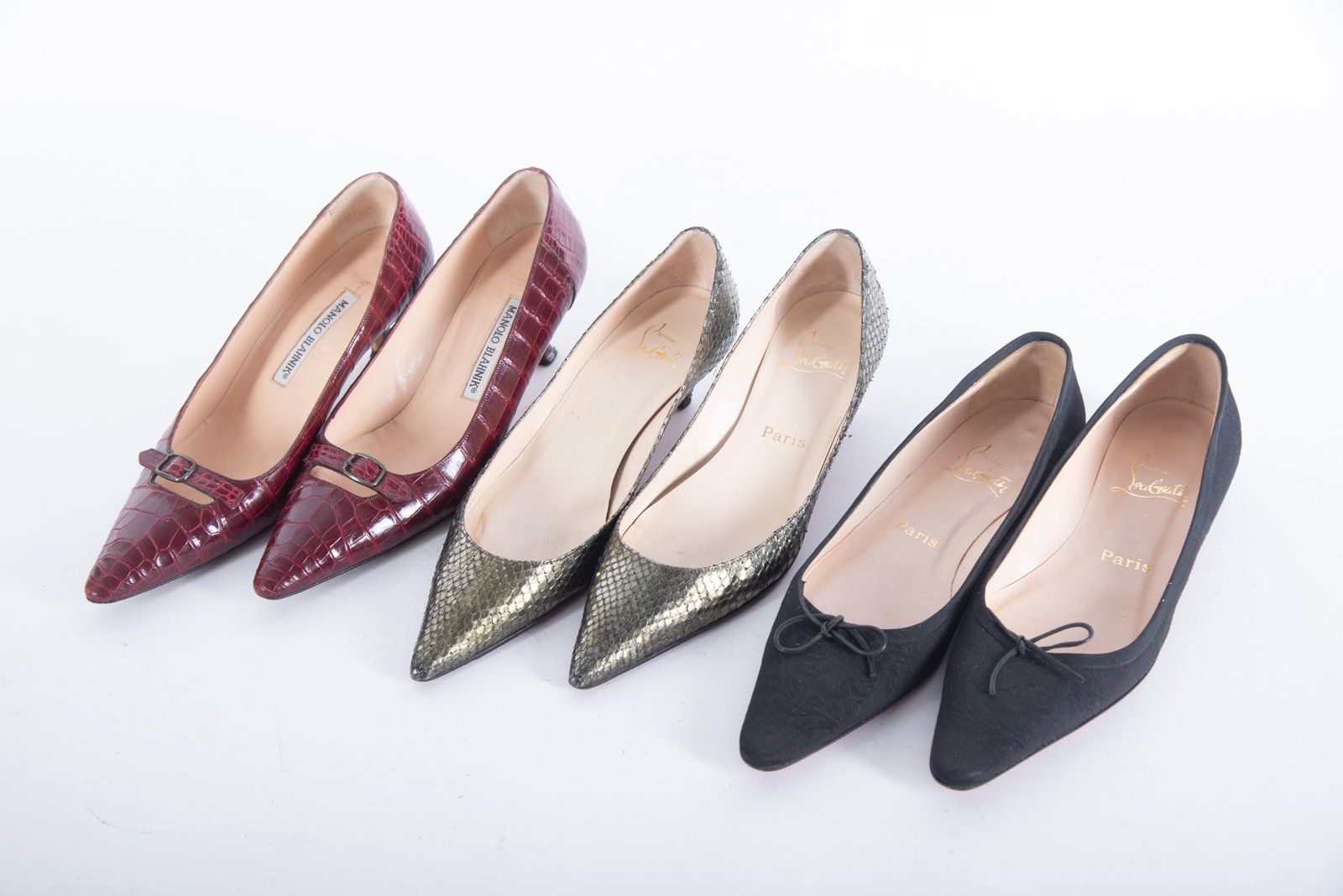 Three Pairs French and Italian Designer Shoes by Christian Louboutin and Manolo Blahnik: Three Pairs French and Italian Designer Shoes by Christian Louboutin and Manolo Blahnik a Christian Louboutin Paris, metallic olive green alligator short heel (2 inch) pump, size 37 1/2; a Christian L