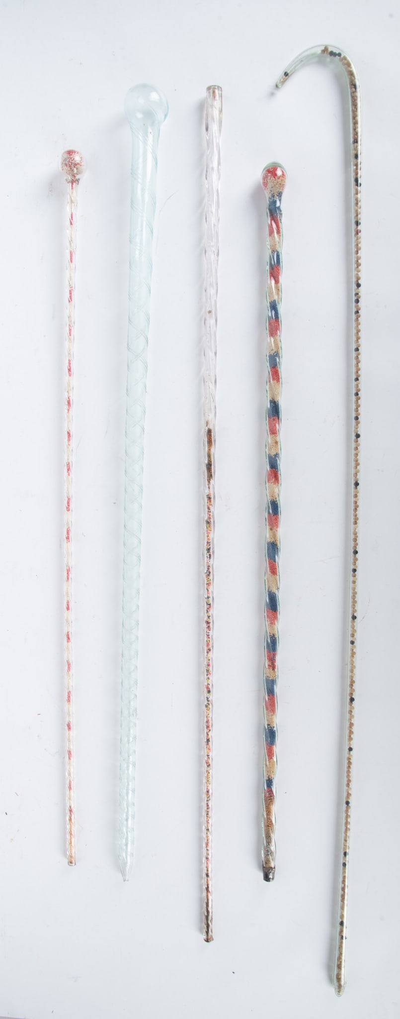 Five Vintage Hand-Blown Novelty Walking Canes: Five Vintage Hand-Blown Novelty Walking Canes Early to mid-20th century, 5 hollow-blown walking sticks, 4 with colorful internal beads. Longest: 44 1/4 inches
