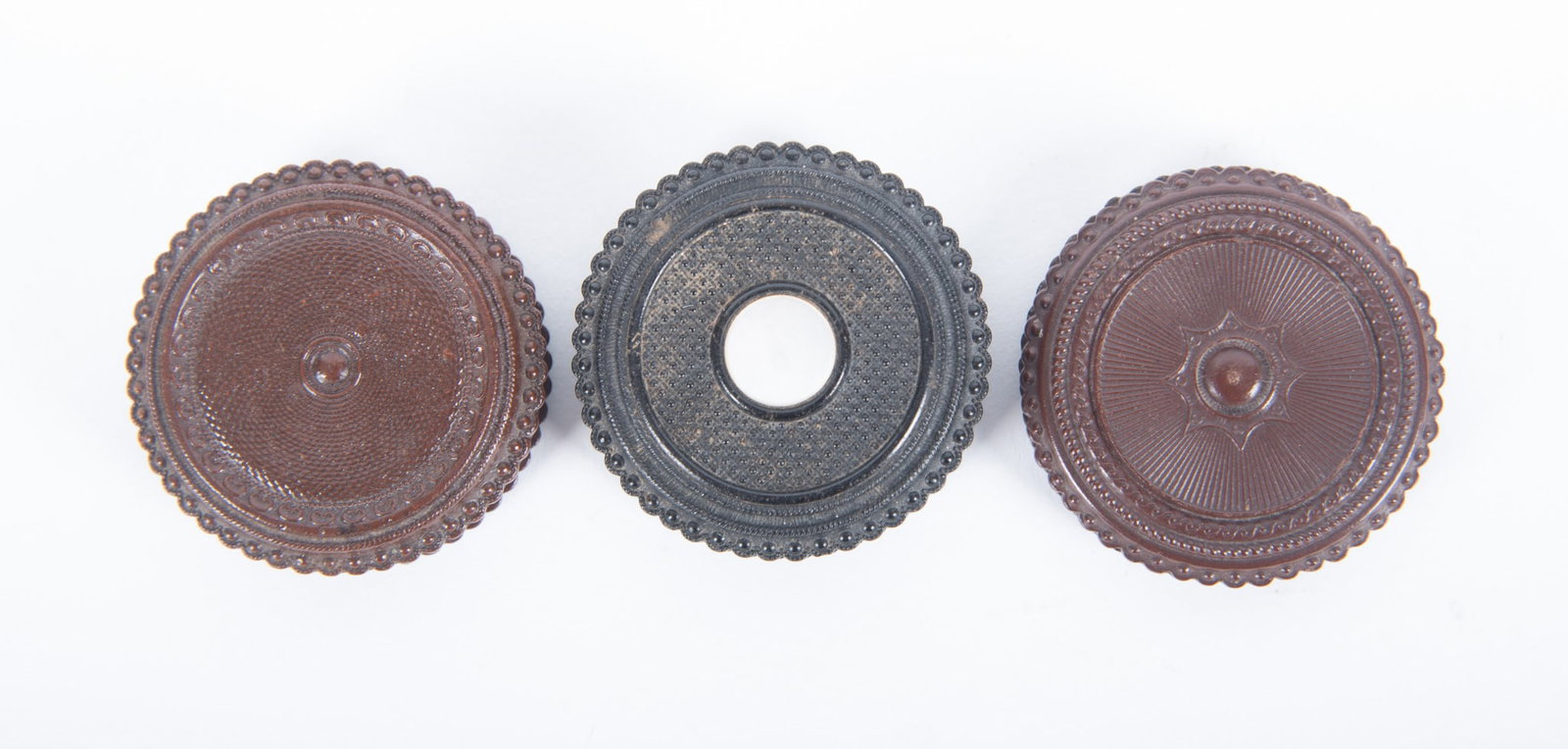 Grouping of Three Round "Oreo" Union Cases: Grouping of Three Round "Oreo" Union Cases "Geometric," sweetheart, case contains two tintype portraits of young girls, 1 3/4" diameter (Krainik-733) scarce; "Geometric," sweetheart, case contains