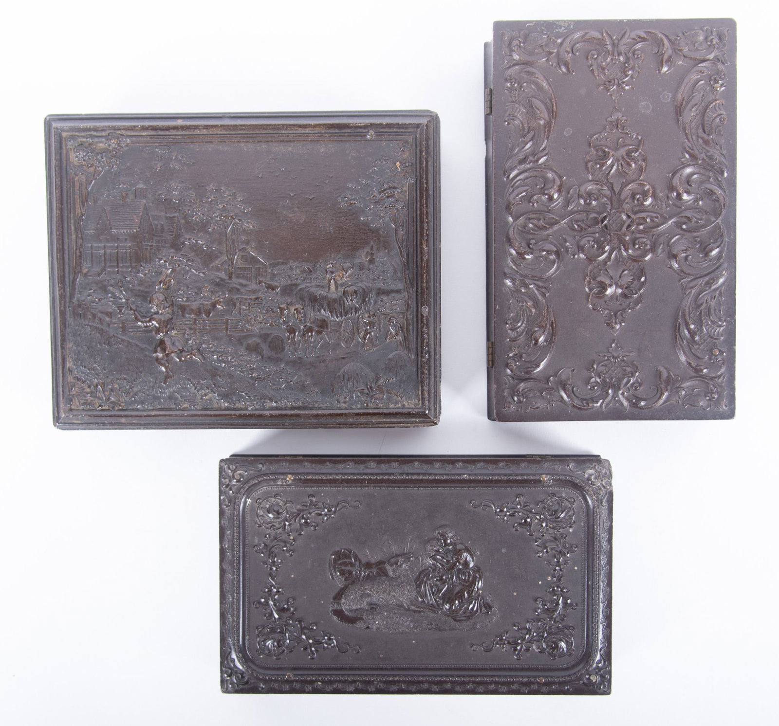 A Grouping of Half-Plate and Double-Sixth Plate Union Cases: A Grouping of Half-Plate and Double-Sixth Plate Union Cases "American Country Life - Summer's Evening, "Littlefield, Parsons and Company, with a daguerreotype family portrait (Krainik-9) a prized Unio