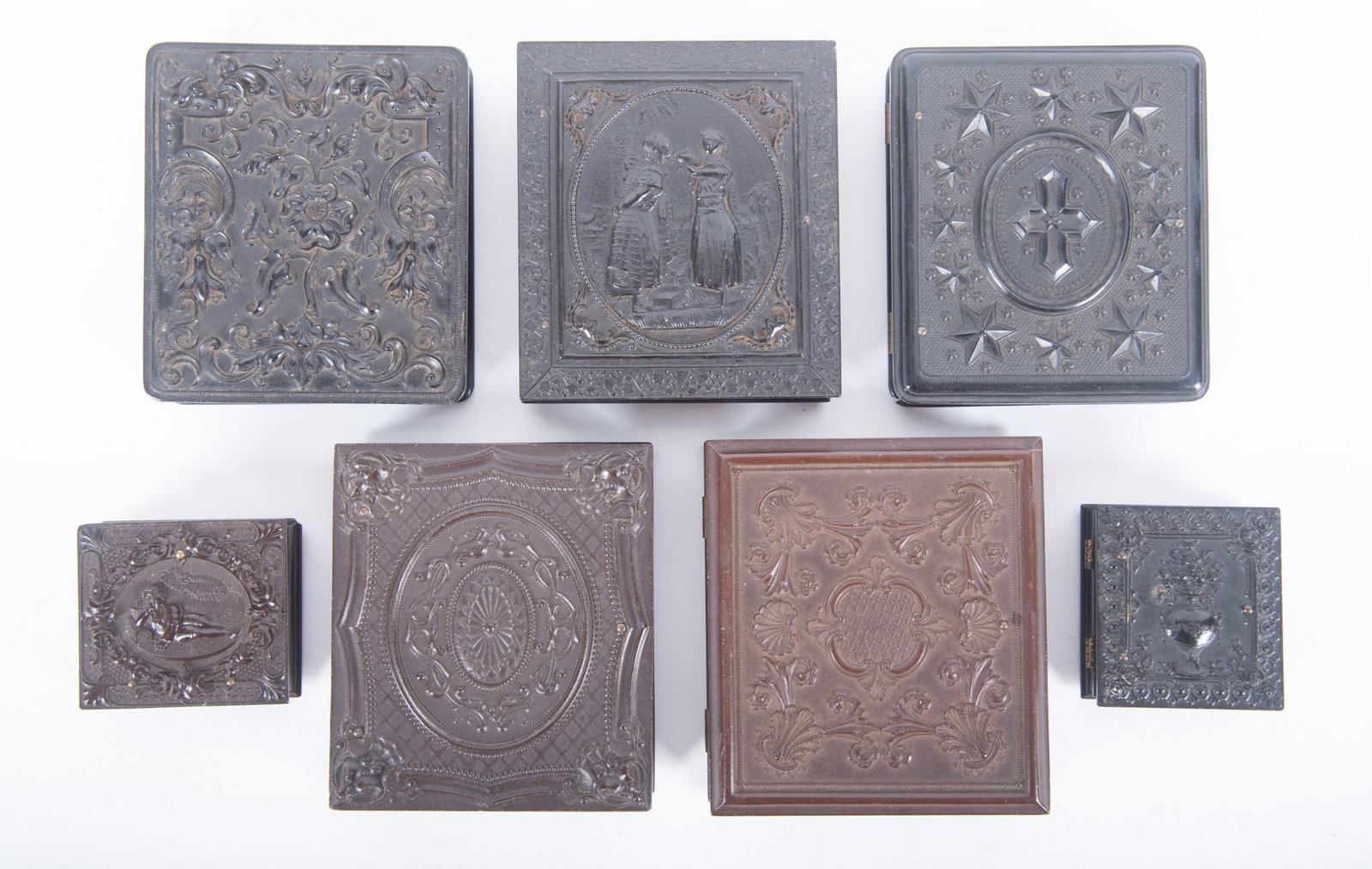 A Grouping of Sixth Plate and Sixteenth Plate Union Cases (Seven): A Grouping of Sixth Plate and Sixteenth Plate Union Cases (Seven) "Rebekah at the Well," S. Peck and Company, with portrait of a woman and young girl (Krainik-155) rare; "A Wildflower," unknown, with