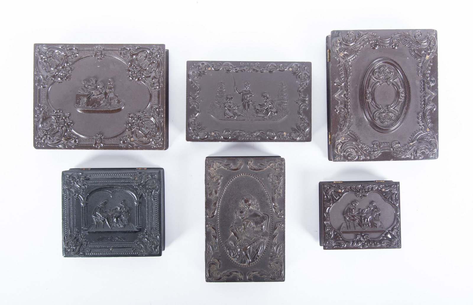 A Grouping of Quarter Plate, Sixth Plate, Ninth Plate, and Double Ninth Plate Union Cases: A Grouping of Quarter Plate, Sixth Plate, Ninth Plate, and Double Ninth Plate Union Cases "The Music Lesson," Anthony Schaefer (eng.), Littlefield, Parsons and Company, with a tintype of a young girl 