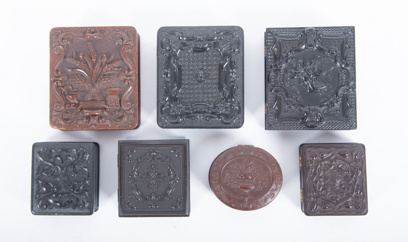A Grouping of Ninth Plate and Sixteenth Plate Union Cases (Seven Total): A Grouping of Ninth Plate and Sixteenth Plate Union Cases (Seven Total) "Agrarian Motif," Frederick C. Key (eng.), Scovill Manufacturing Company, with a daguerreotype portrait of a man (Krainik-375); 