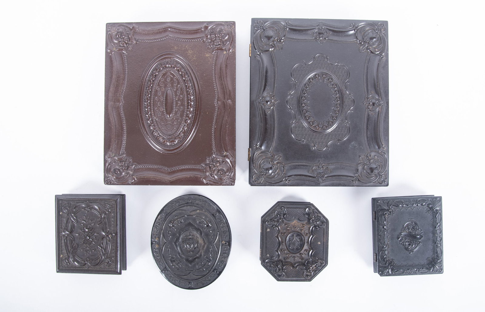A Grouping of Half Plate and Ninth Plate Union Cases (Six Total): A Grouping of Half Plate and Ninth Plate Union Cases (Six Total) "Geometric/Scroll," Littlefield, Parsons and Company, ambrotype portrait of a man (Krainik-15) rare; "Geometric/Scroll," Peck and Halvo