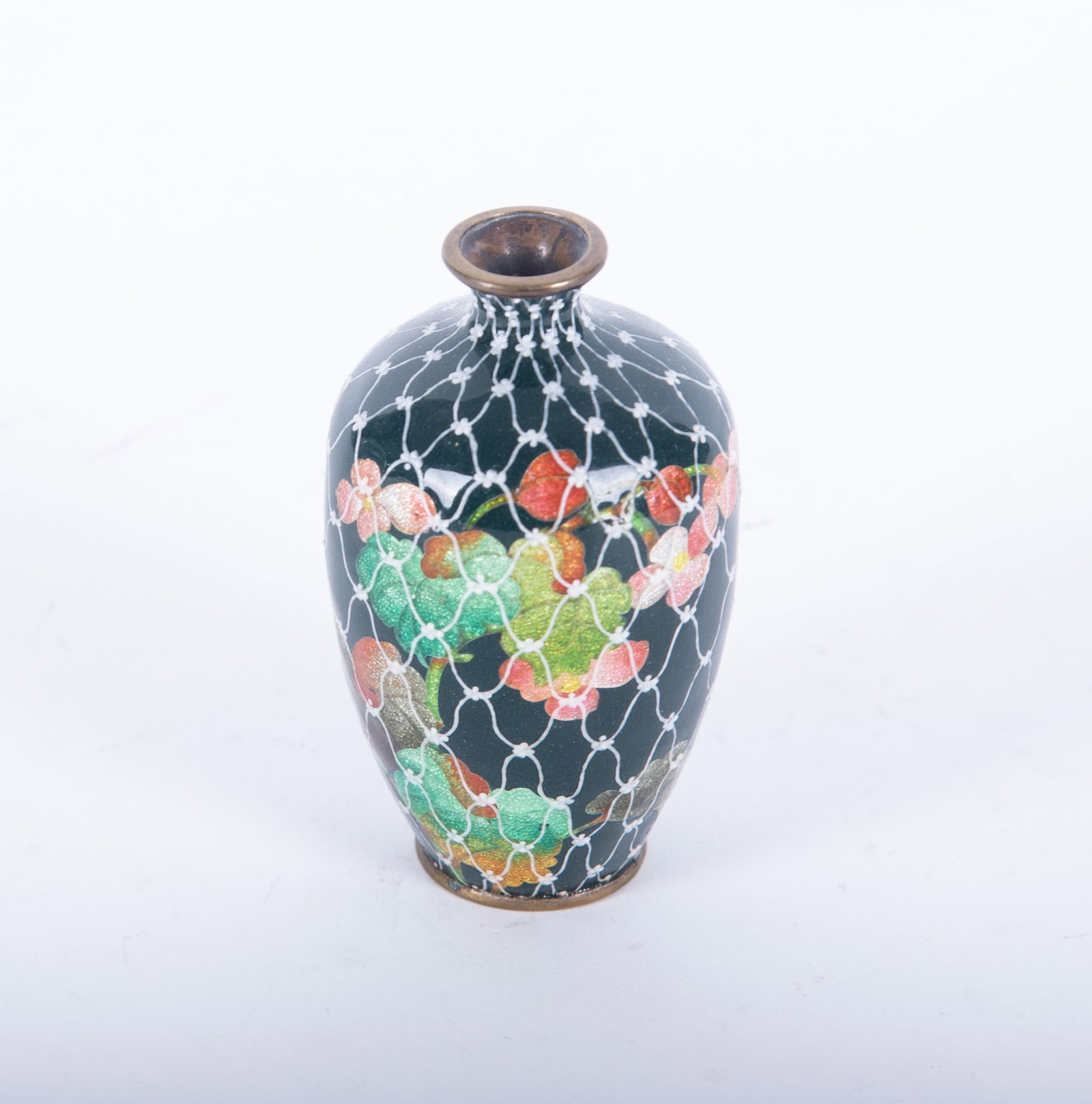 A Japanese Miniature Ginbari Cloisonne Vase: A Japanese Miniature Ginbari Cloisonne Vase Japan, Meiji period, a finely enameled dark green ground enamel vase with botanical decorations in "fish-scale" enameling. The vase is covered in a white