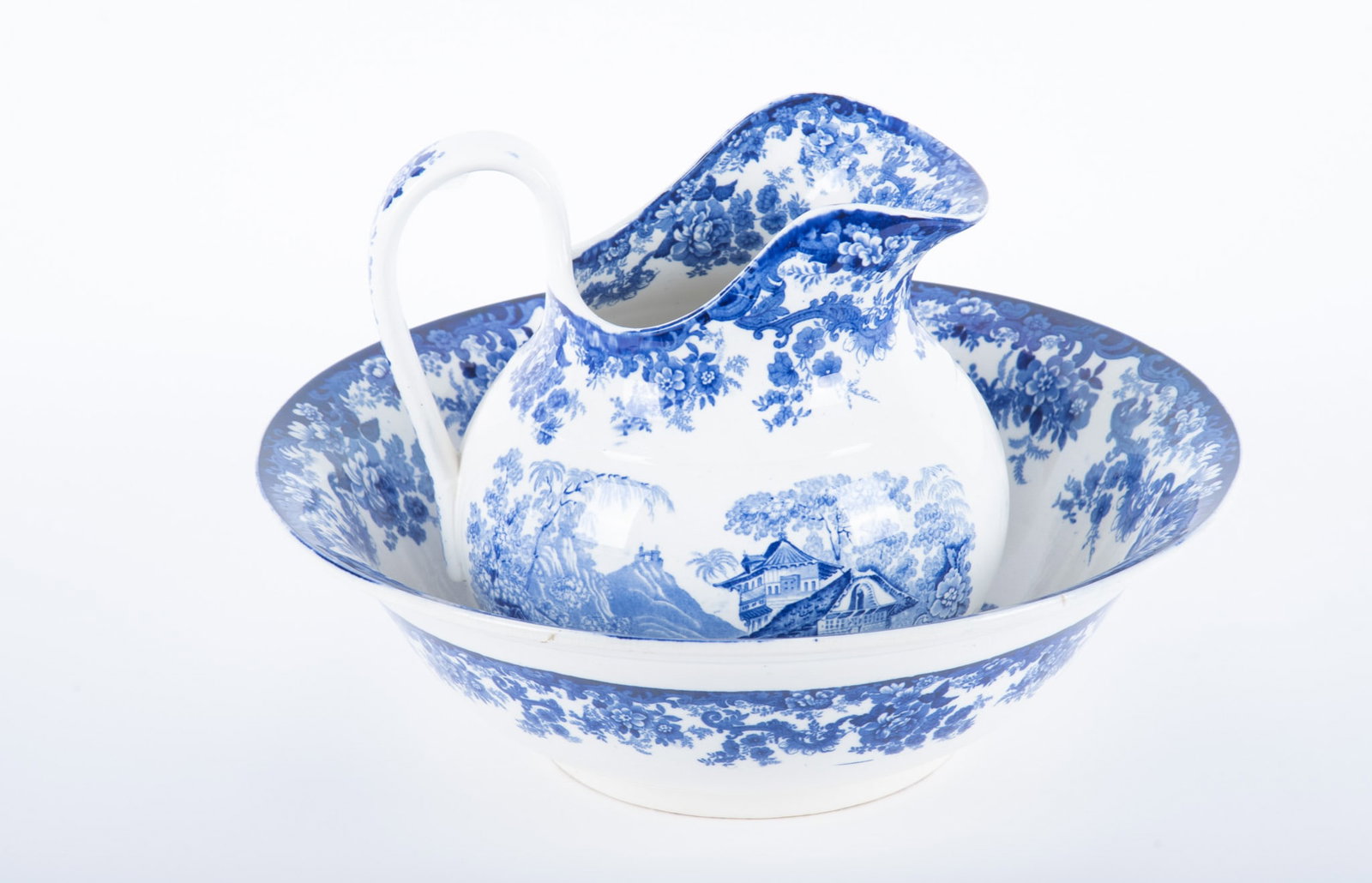 A Large 19th Century Minton Genevese Pitcher and Bowl Set: A Large 19th Century Minton Genevese Pitcher and Bowl Set England, late 19th century, a matched pitcher and bowl set, both decorated with images of a Swiss mountain village with scrolling floral