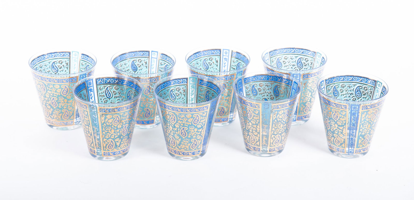 Mid-Century Modern Glassware 'Paisley' and 'Golden Celeste' by Georges Briard: Mid-Century Modern Glassware 'Paisley' and 'Golden Celeste' by Georges Briard 8 mid-century whiskey glasses in blue paisley pattern and 7 mid-century modern whiskey glasses in Golden Celeste pattern. 