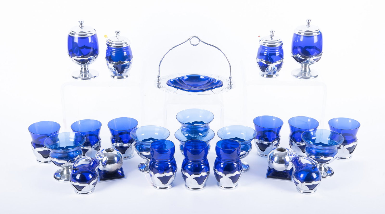 A Collection of Art Deco Cambridge and Farber Brothers Cobalt and Chrome Bar and Table Articles: A Collection of Art Deco Cambridge and Farber Brothers Cobalt and Chrome Bar and Table Articles In the Farber Brothers Krome-Kraft line featuring vibrant cobalt blue Cambridge glass inserts within the