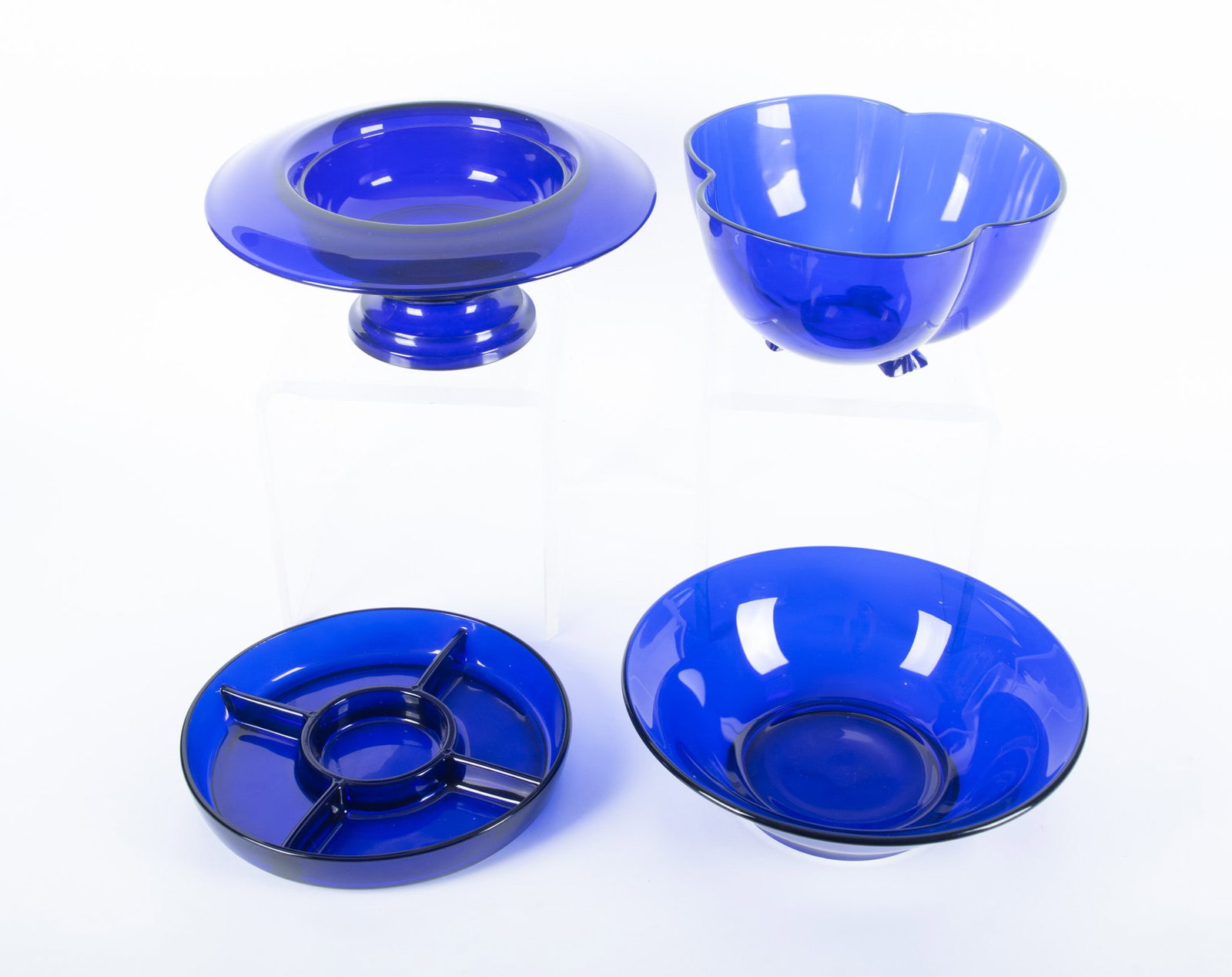 Four Art Deco Period Cobalt Glass Bowls: Four Art Deco Period Cobalt Glass Bowls The collection of cobalt glass includes: a wide rim center bowl with a June 24, 1924, patent date (5 x 12 inches), a round sectioned bowl marked Made in France 