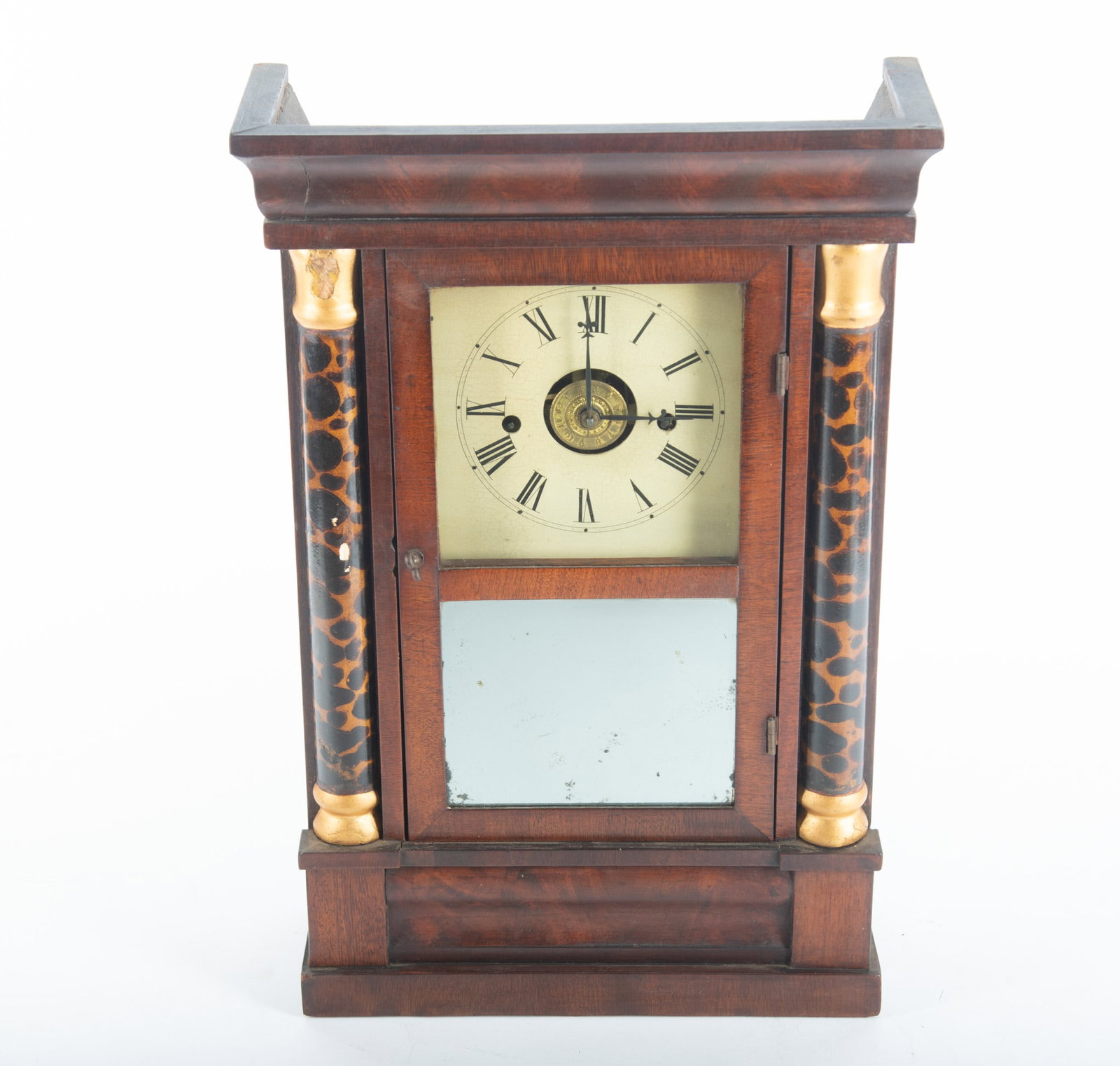 Antique American Eight Day Shelf Clock: Antique American Eight Day Shelf Clock Ogee form cornice above a dial with Roman Numeral chapter ring and a mirrored panel centering faux tortoise shell half columns on straight base. 18 x 12 x 4 1/4 