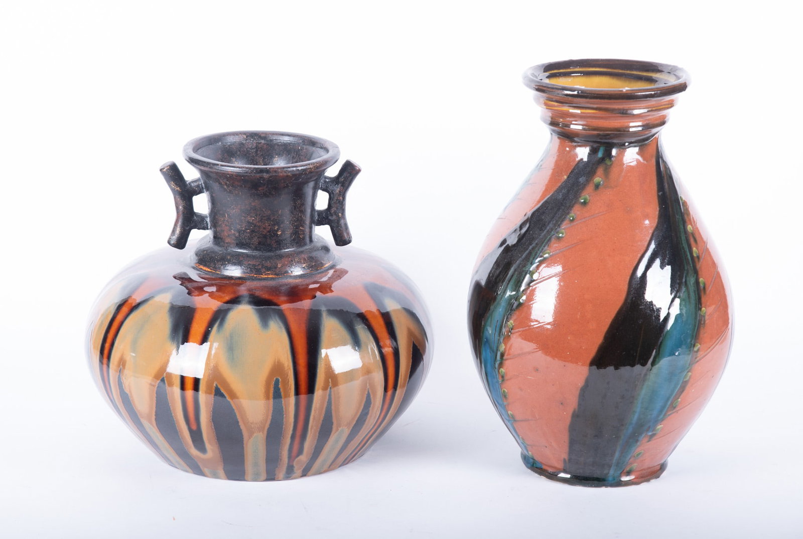 Two Large Herman Kahler Pottery Art Vases: Two Large Herman Kahler Pottery Art Vases Denmark. HK marked on the underside of the taller vase. 16 1/4 x 10 x 10 inches (taller); 12 1/2 x 14 x 14 inches (wider)