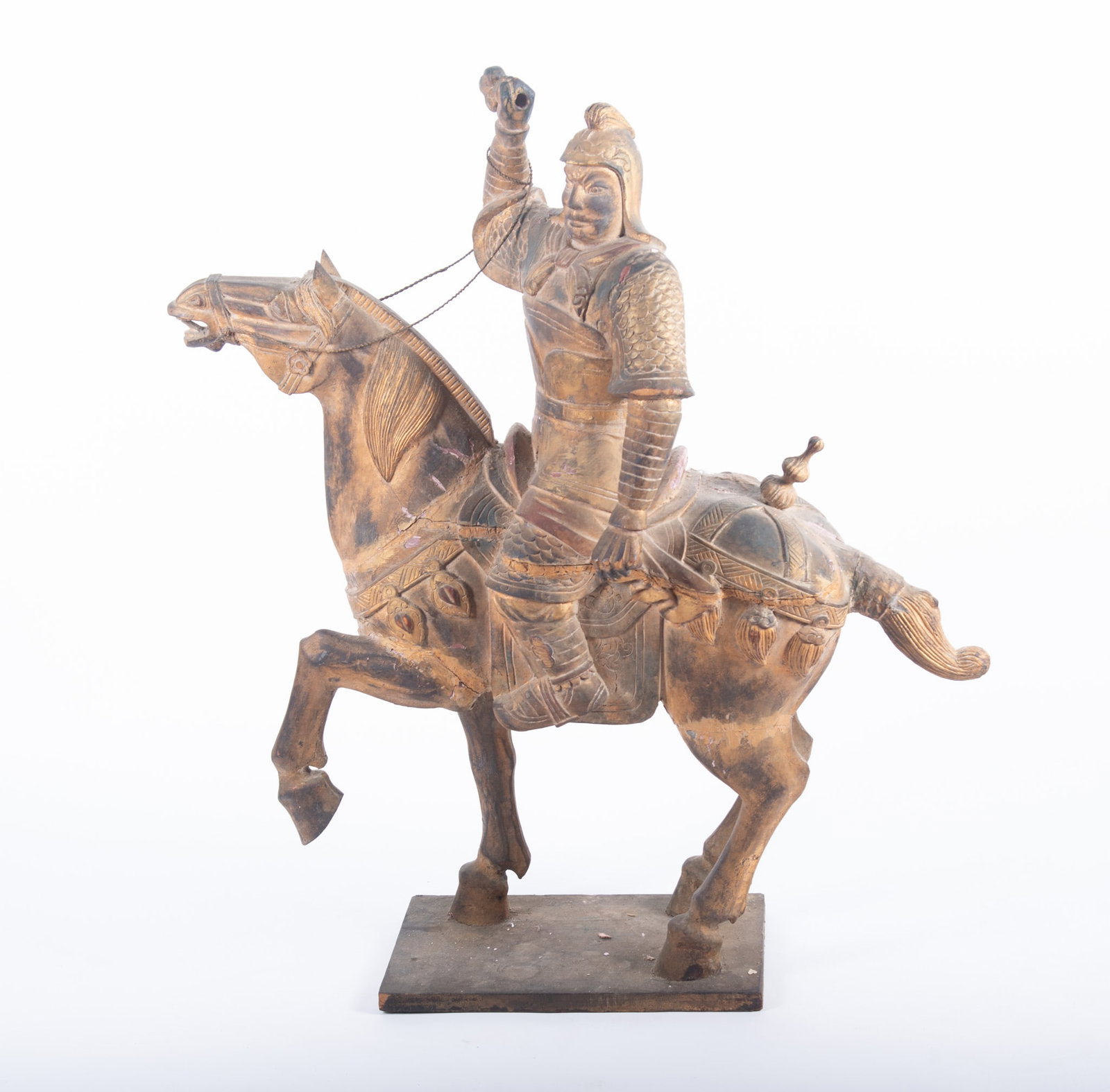 A Large Antique Carved Wood Sculpture of a Chinese Warrior on Horseback: A Large Antique Carved Wood Sculpture of a Chinese Warrior on Horseback Plychrome-decorated figure group; the warrior has his hand raised and is missing his sword. 49 x 42 x 11 inches