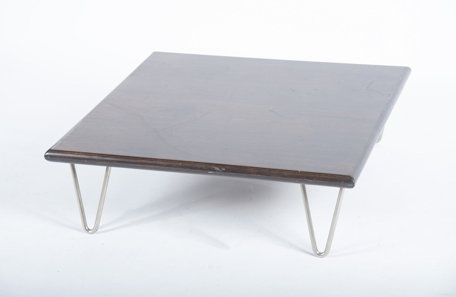 Modernica Low Coffee Table: Modernica Low Coffee Table Square wood top with metal hairpin legs, marked "Modernica, Los Angeles" Height: 10 inches; Top: 33 x 33 inches