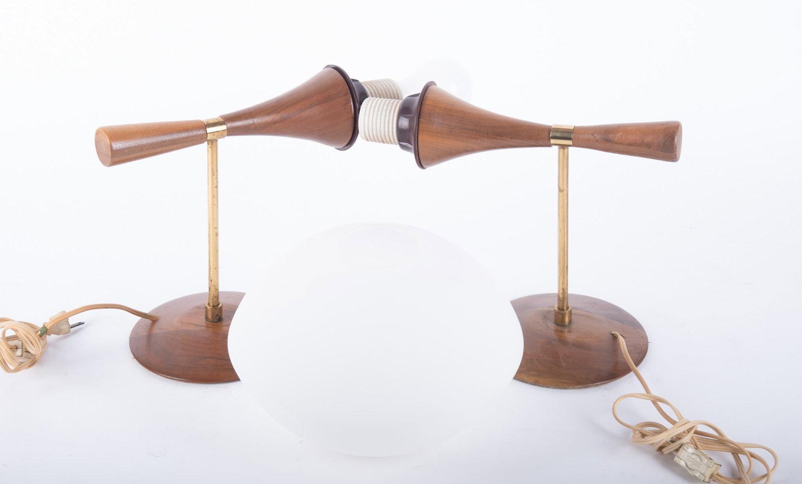 Pair Mid-Century Modern Wall Sconces: Pair Mid-Century Modern Wall Sconces Pair of wall mounted wooden cone shaped figures with gold tone hardware and a single white globe shade.