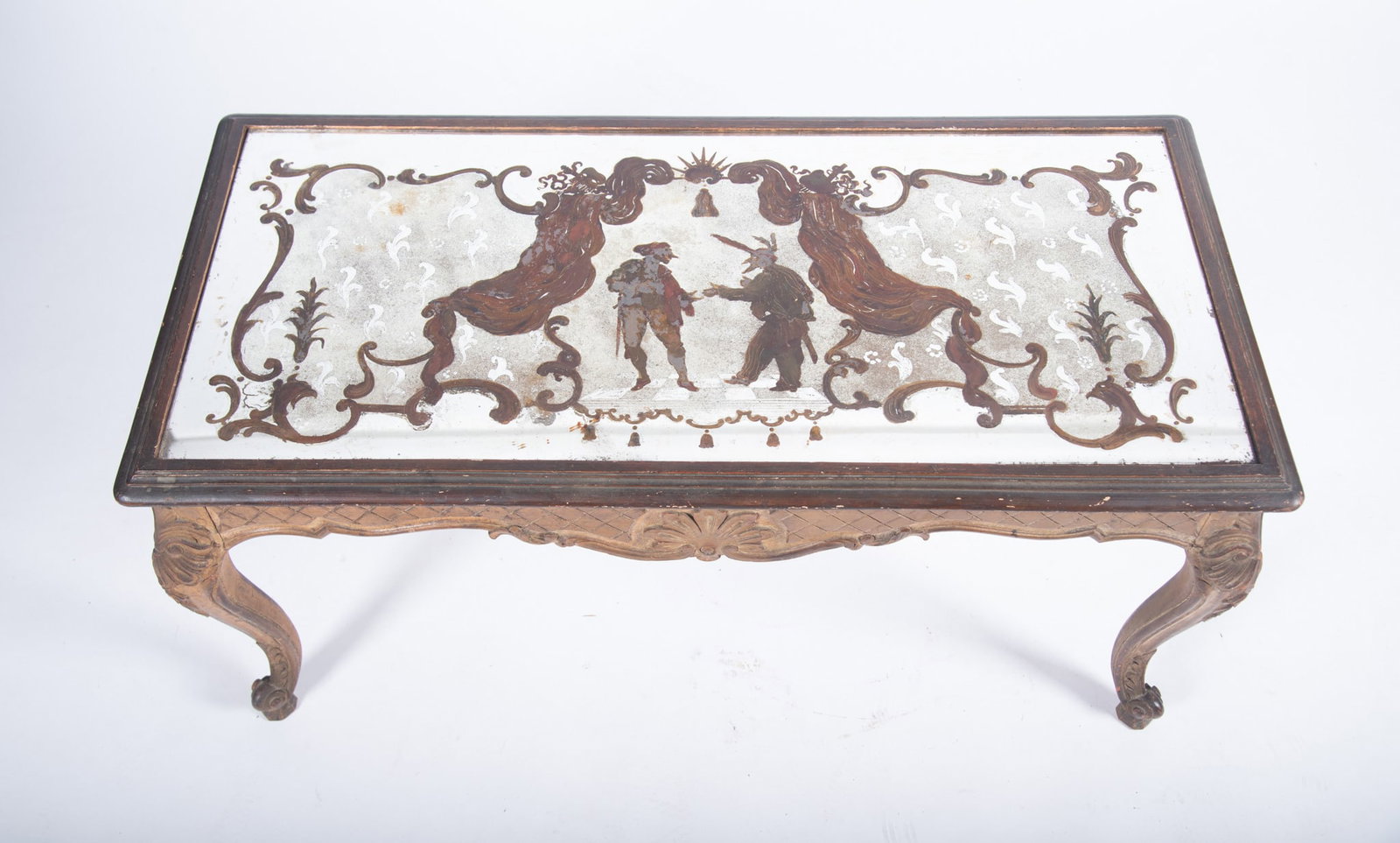 Twentieth Century Italian Coffee Table: Twentieth Century Italian Coffee Table The reverse painted mirrored top showing figures in an interior scene above a serpentine apron with diamond pattern and central cockle shell motif all supported