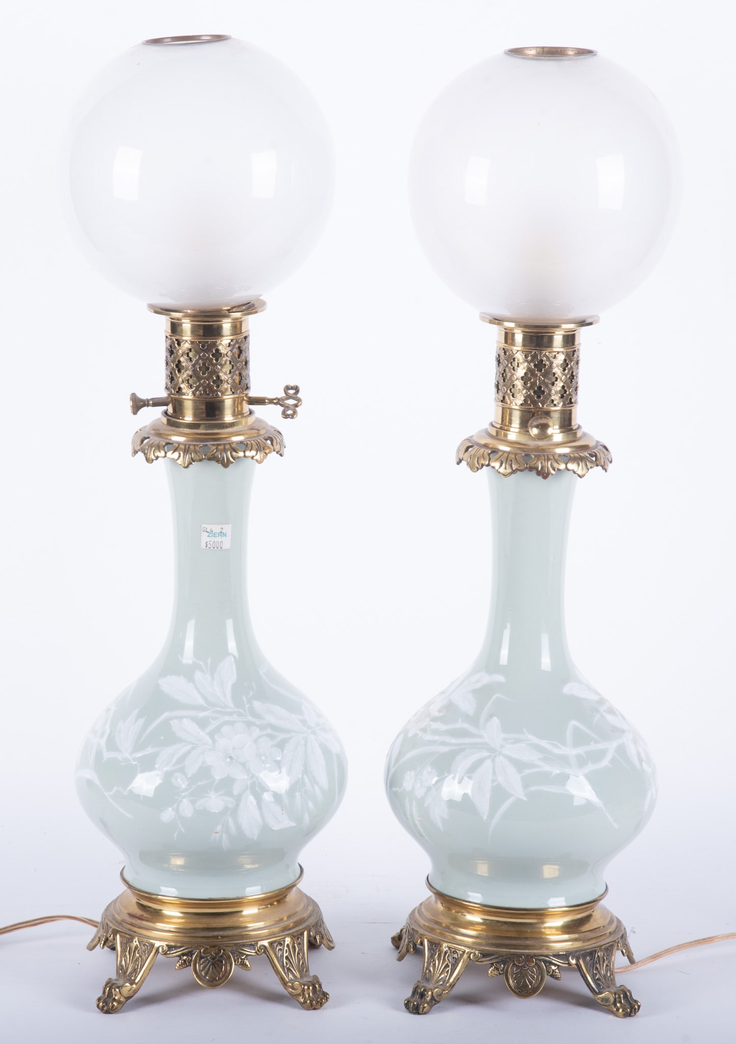Pair of Celadon Porcelain Pate sur Pate Table Lamps, Late 19th Century: Pair of Celadon Porcelain Pate sur Pate Table Lamps, Late 19th Century A late 19th century celadon porcelain lamp, "pate sur pate" with floral decoration on body. Bronze base and fittings with globe g