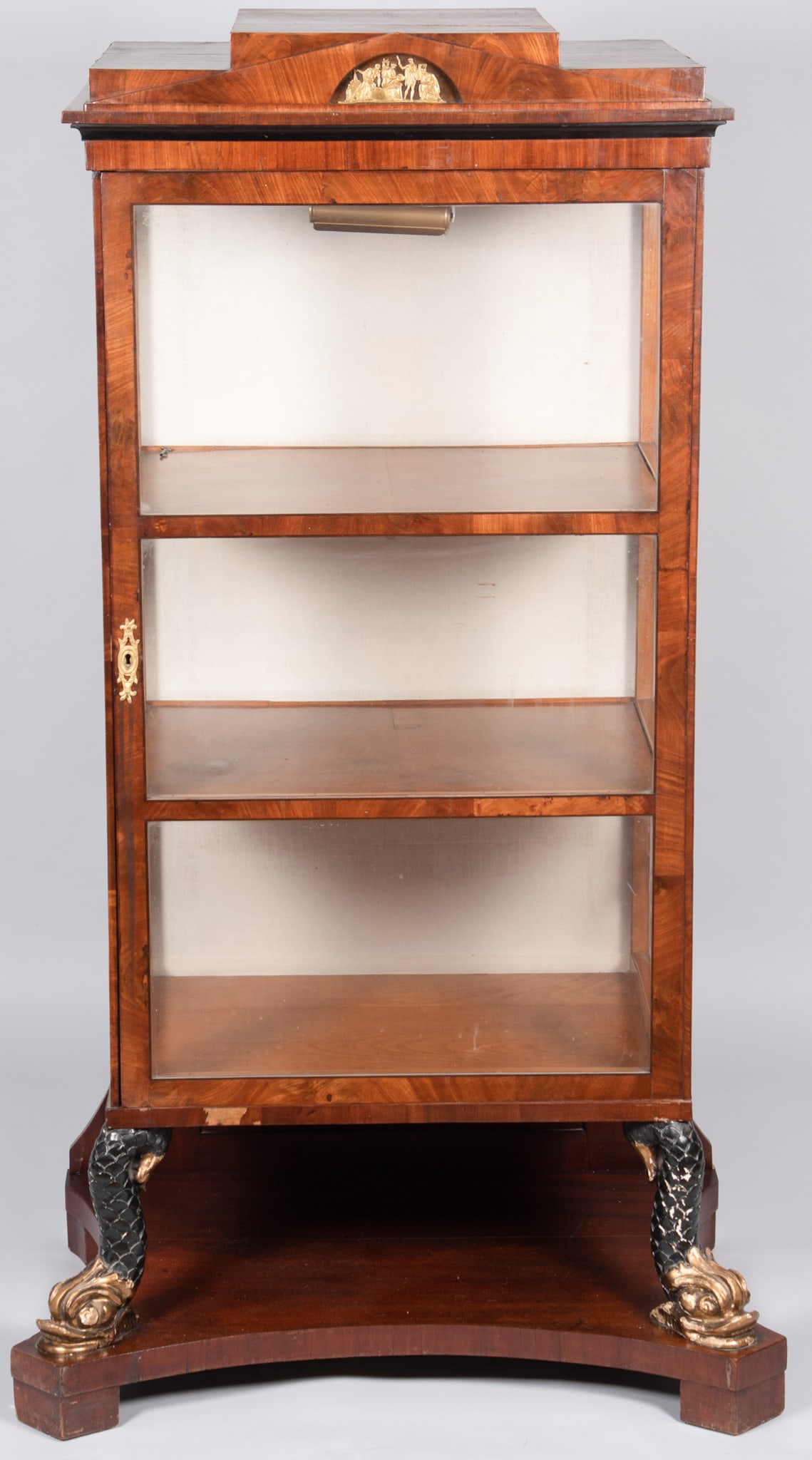 Antique Biedermeier Vitrine Cabinet, Early 19th Century: Antique Biedermeier Vitrine Cabinet, Early 19th Century Continental, early 19th century, the deep vitrine cabinet of dark veneer with stepped "temple" top centering a neoclassoc bronze plaque, rising