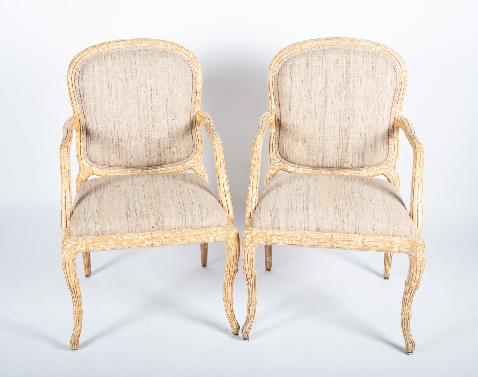 Pair Of Modern French Design Arm Chairs: Pair Of Modern French Design Arm Chairs Naturalistic frames with arched form head rails above upholstered backs and seats centering open arms ending on tapering and cabriole fluted legs. 40 x 23 1/2