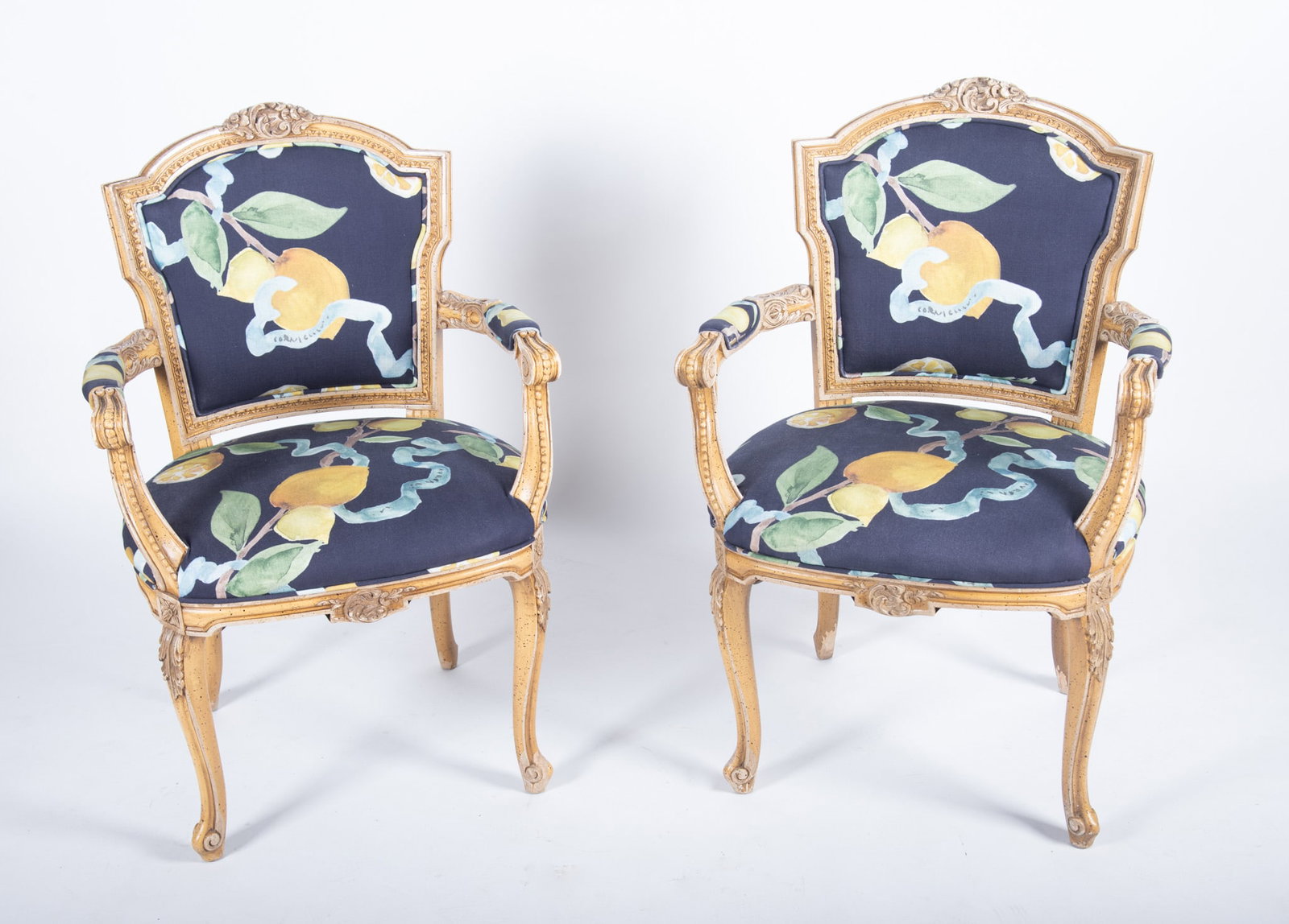 Pair Of Louis XV Style Open Arm Chairs: Pair Of Louis XV Style Open Arm Chairs Floral head rail above floral upholstered shield backs above matching upholstered seats centering a pair of padded arms ending on shaped legs. 37 x 24 x 24