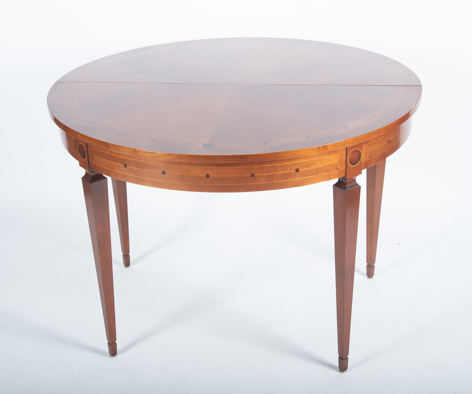Twentieth Century English Design Sheraton Flip Top Demi-Lune Table: Twentieth Century English Design Sheraton Flip Top Demi-Lune Table Ribbon inlaid top with circular design opening to a round top with a double gateleg support and ribbon inlaid apron all raised on
