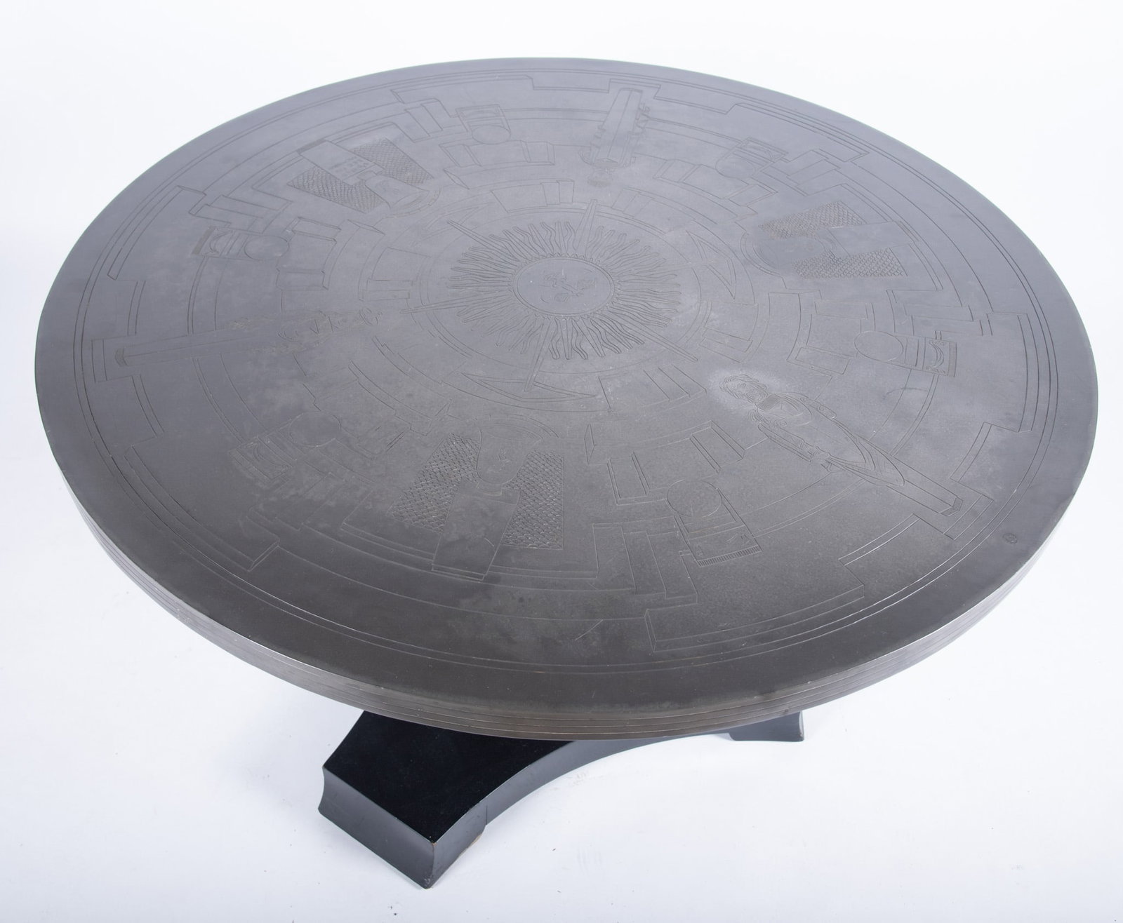 Asian Center Table With Pewter Top: Asian Center Table With Pewter Top The etched design on the top centers on a sun, encircled by four standing figures, vases, and geometric patterns, Diameter of top: 45 inches; Height: 28 inches