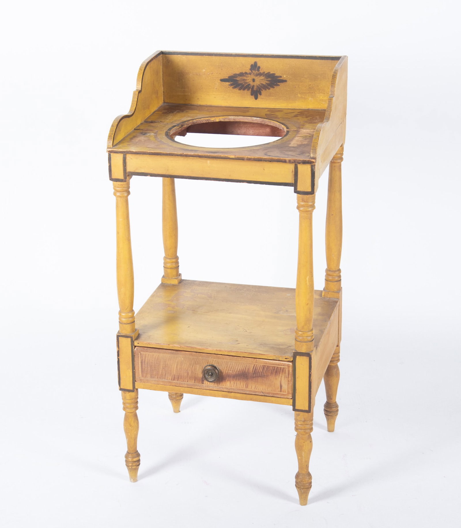 Antique Early 19th Century Sheraton Pennsylvania Wash Stand: Antique Early 19th Century Sheraton Pennsylvania Wash Stand Original yellow hand painted floral design with three quarter gallery above a single drawer raised o turned legs. 37 1/2 x 17 3/4 x 15 3/4 i