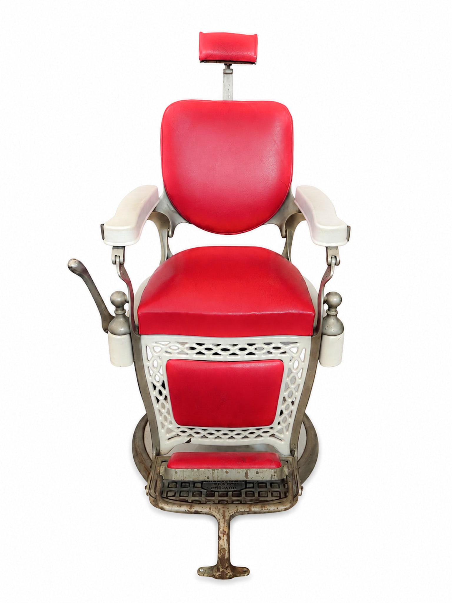 Early Emil J. Paider Vintage Barbers Chair: Early Emil J. Paider Vintage Barbers Chair White cast iron and enameled paint with red upholstered head rest, back and seat with lattice work reticulation below. 50 x 24 1/2 x 36 inches