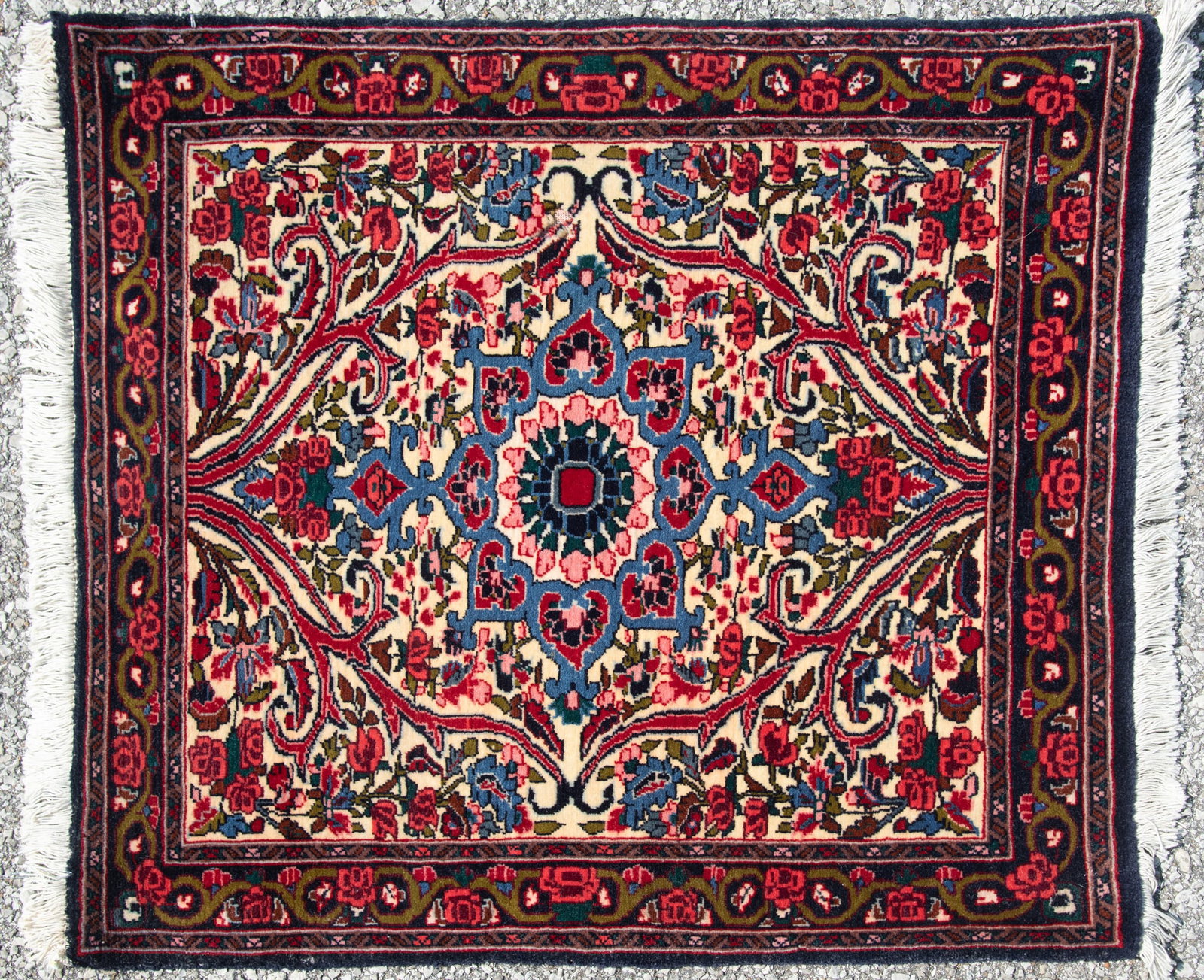 Persian Handwoven Bidjar Mat: Persian Handwoven Bidjar Mat Multi tiered and lobed medallion in blue, pink, green and red framed with scrolling vines on an ivory field having a floral primary border. 2' 5" x 2' 9"