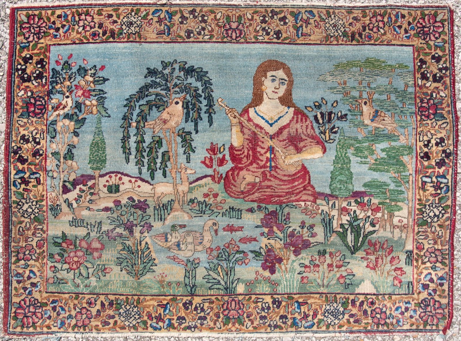 Handwoven Persian Pictorial Throw Rug: Handwoven Persian Pictorial Throw Rug Showing a woman playing a stringed instrument amid a landscape with foliage, birds, deer and ducks. 2' 1" x 2' 9"